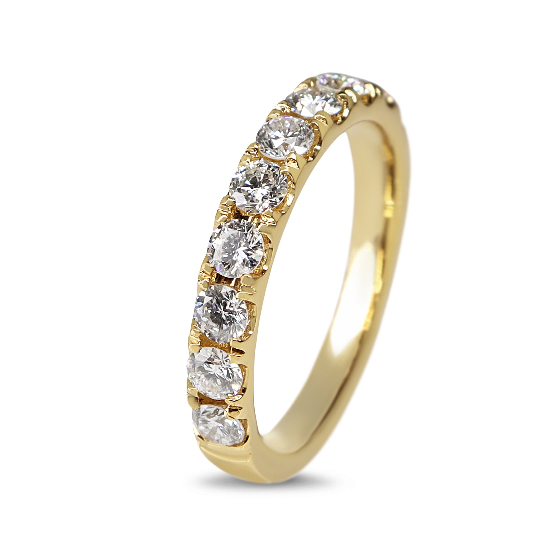 Close-up detail of the diamonds set across the yellow gold half hoop band