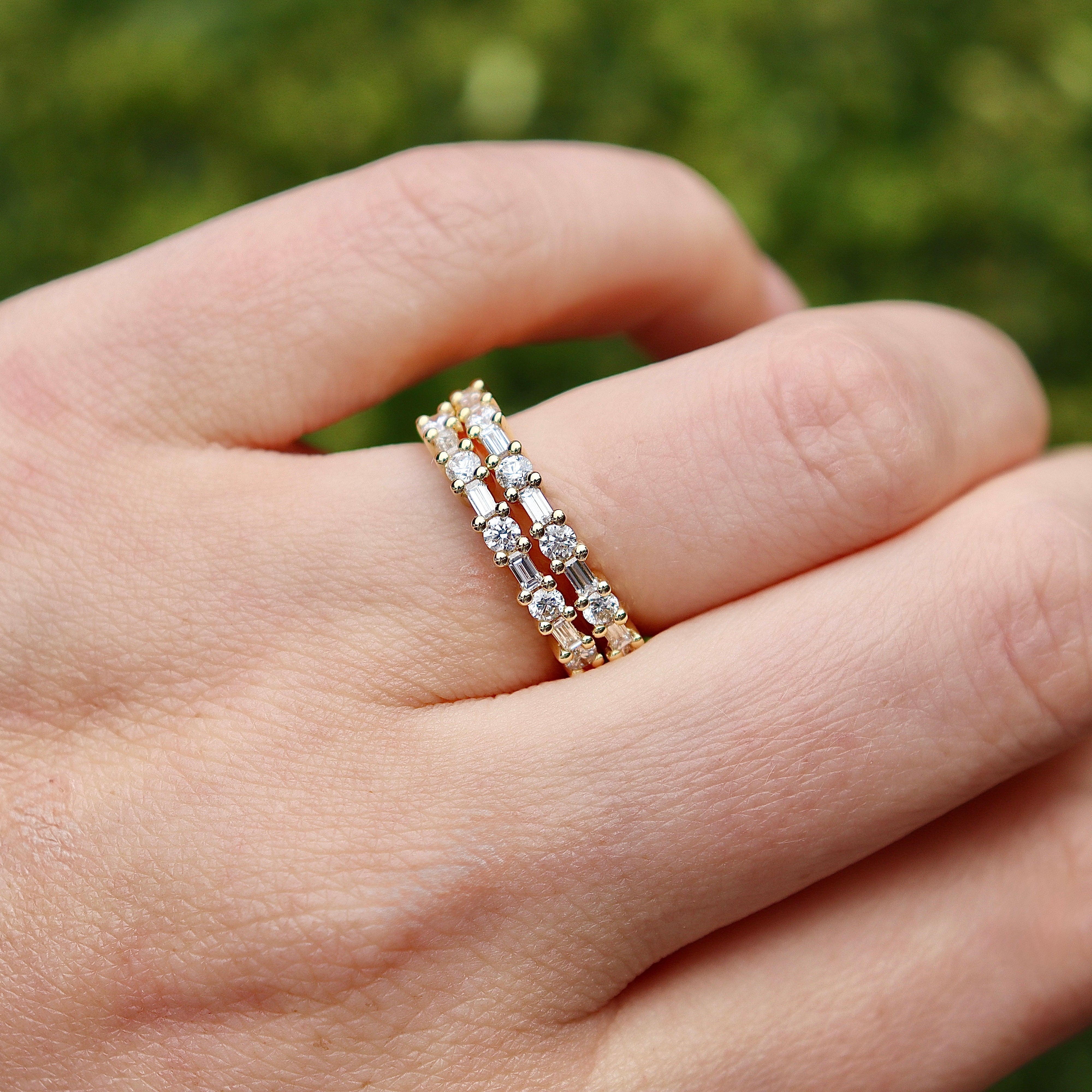 18ct yellow gold .55ct diamond wedding band shown in full, highlighting its elegant 2.7mm proportions