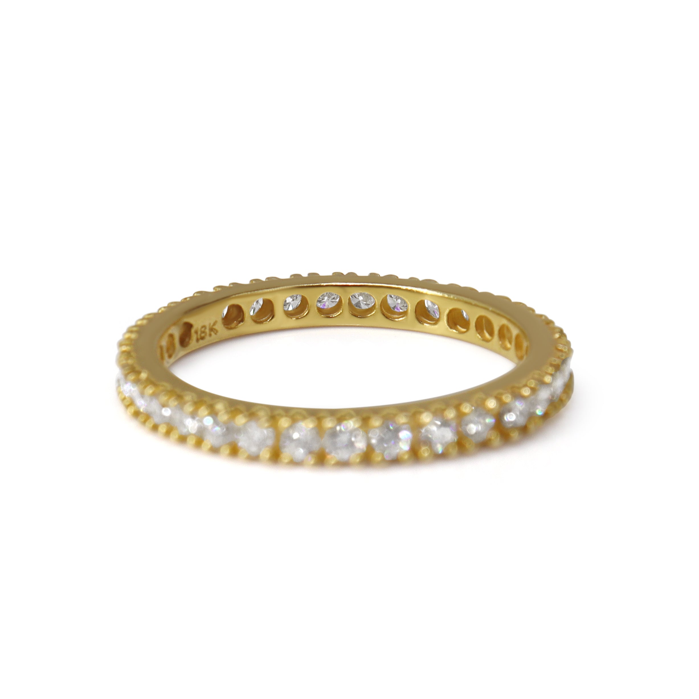 Profile view of diamonds set around 18ct yellow gold wedding band