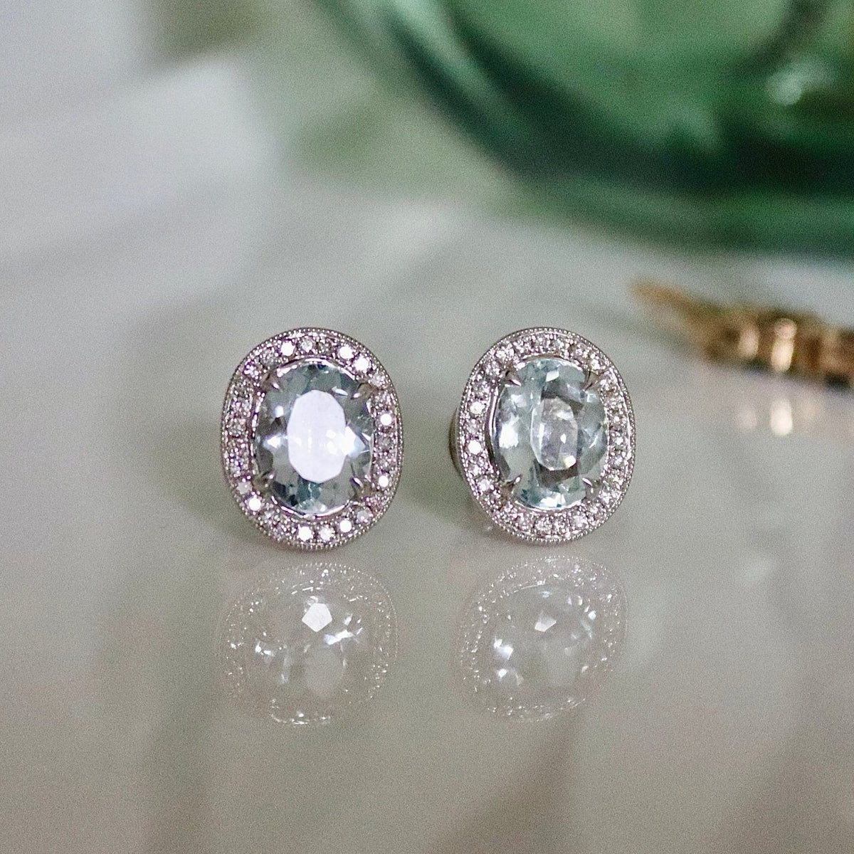 18ct White Gold Oval Aquamarine and Diamond Halo Stud Earrings - Burlington Jewellery