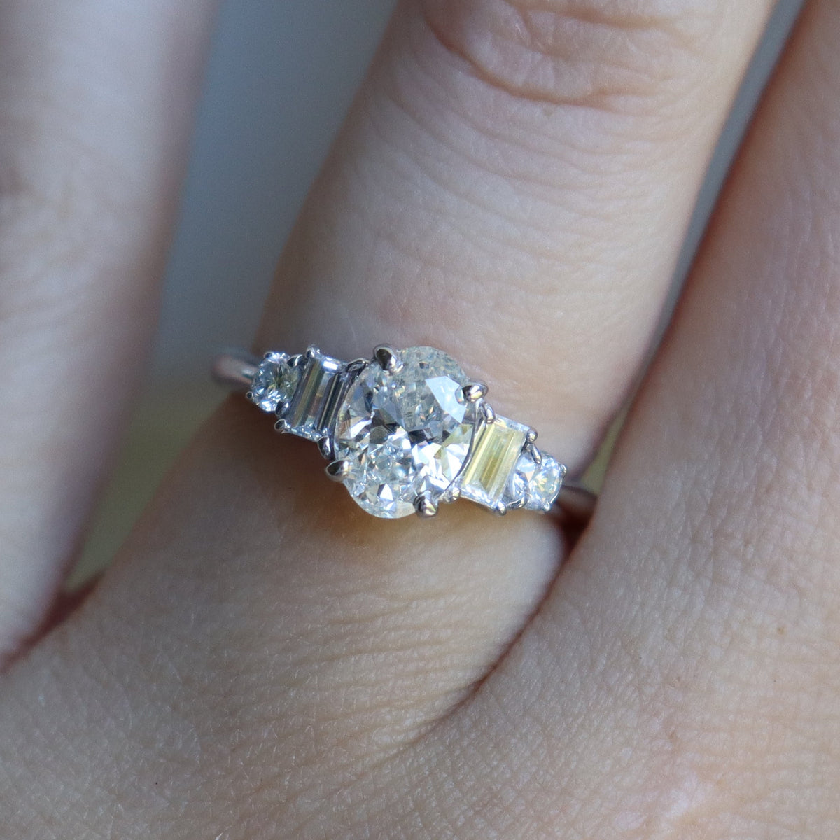 Platinum Oval and Baguette Diamond 5 Stone Ring
