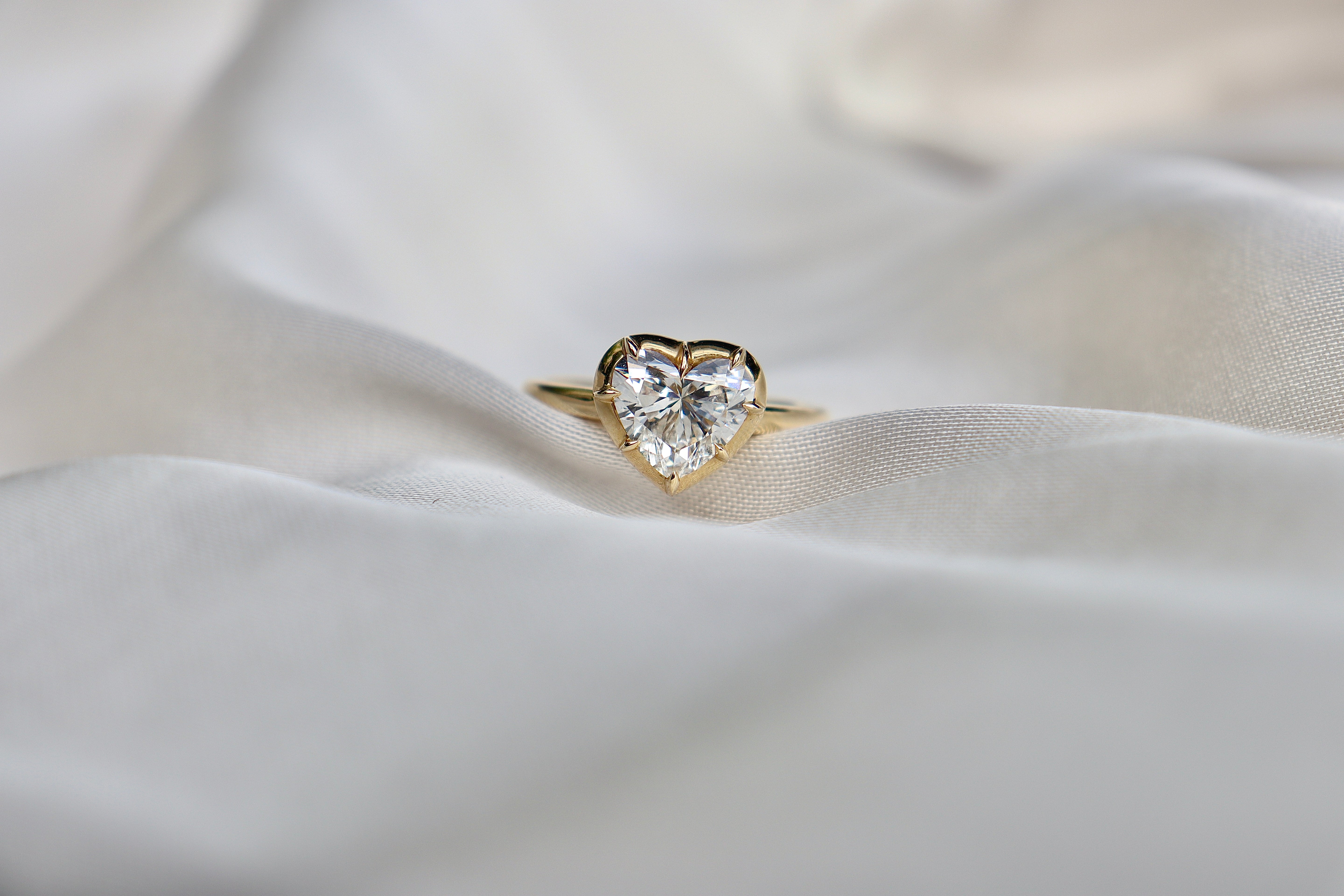 Luxury yellow gold engagement ring with heart diamond