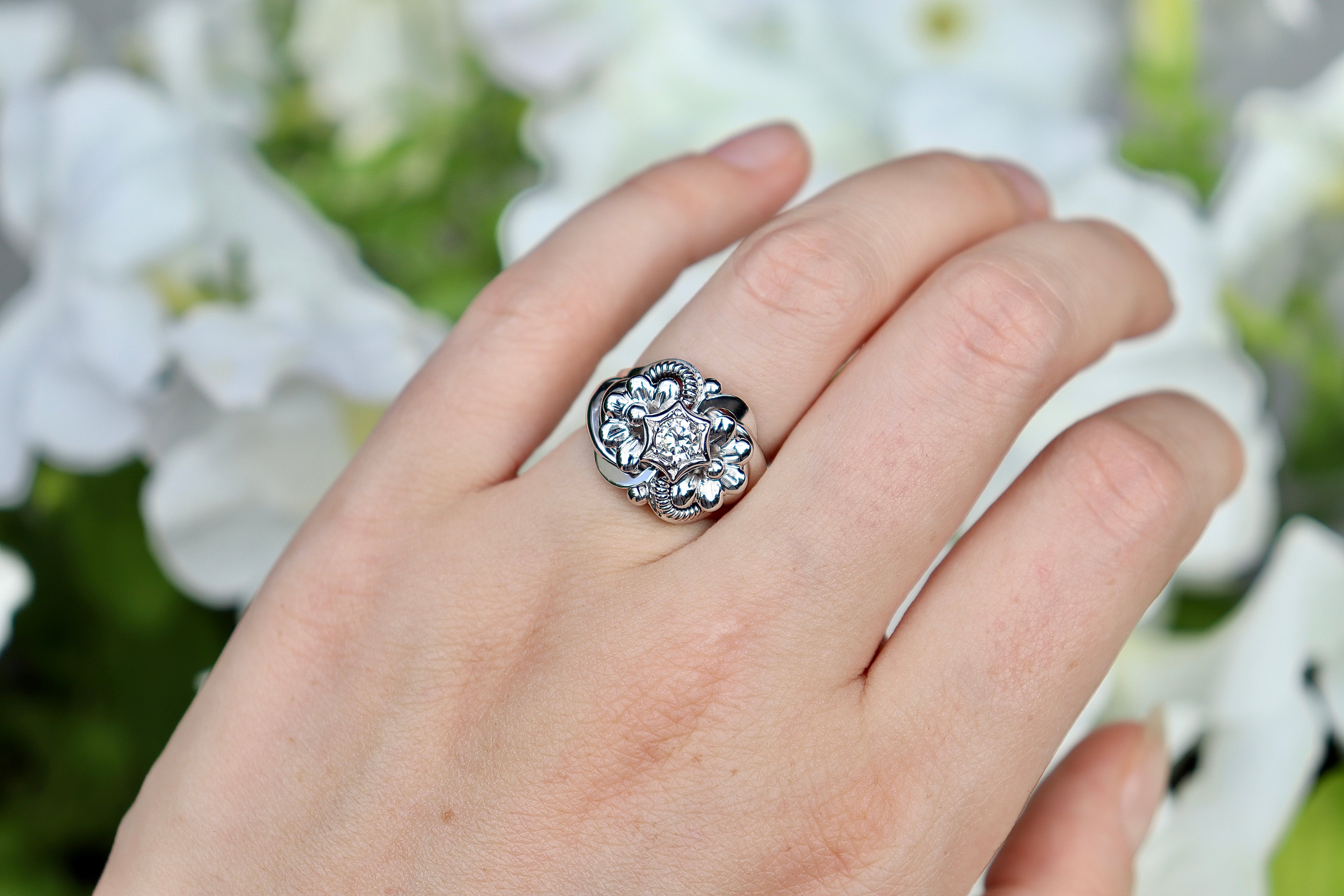 Ornate diamond ring on hand for engagement or wedding