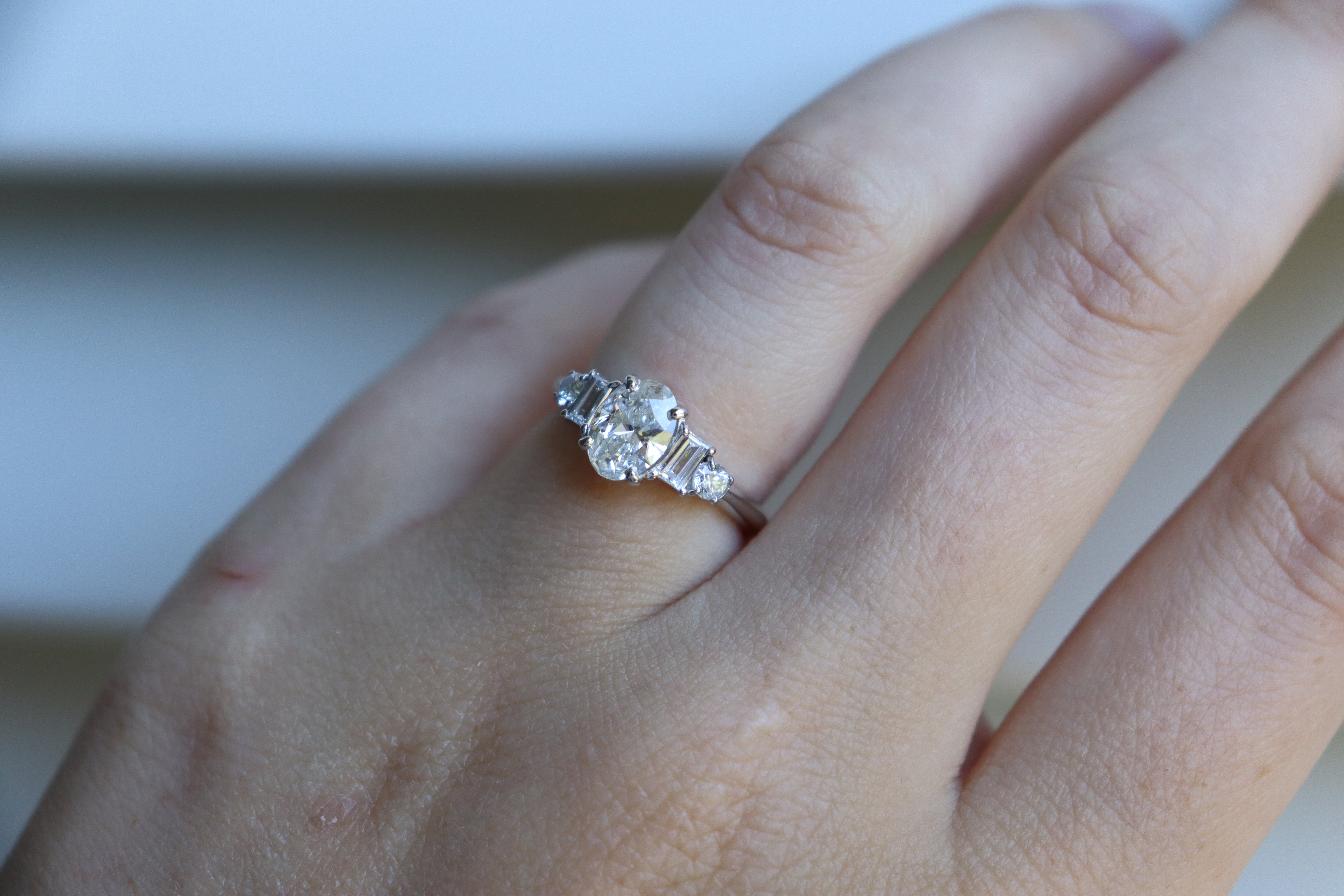 Platinum Oval and Baguette Diamond 5 Stone Ring