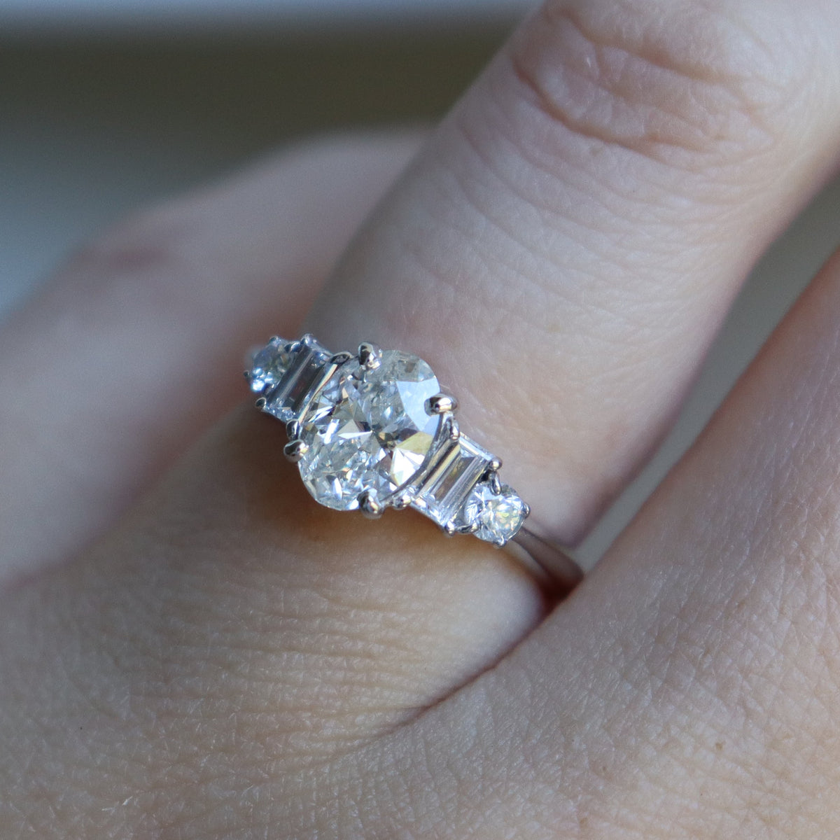 Platinum Oval and Baguette Diamond 5 Stone Ring