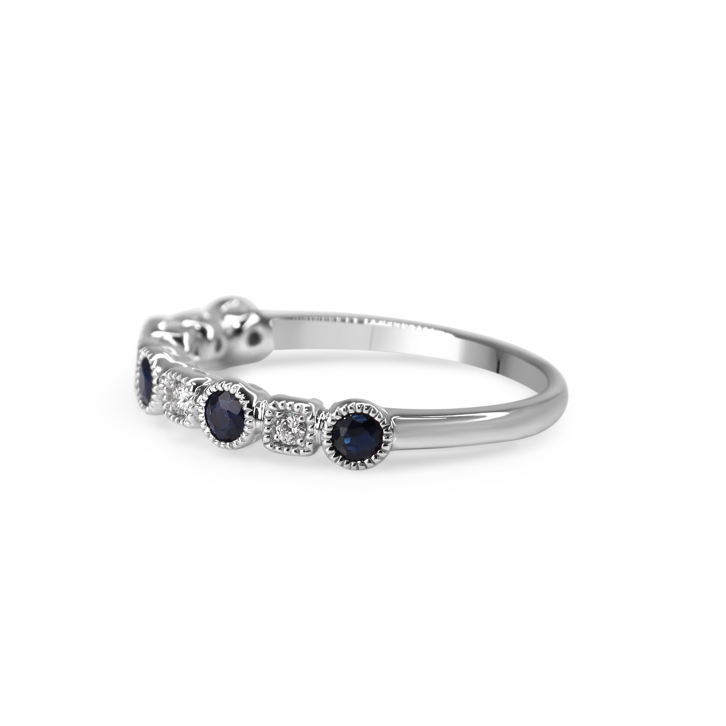 Side view of white gold sapphire and diamond wedding band