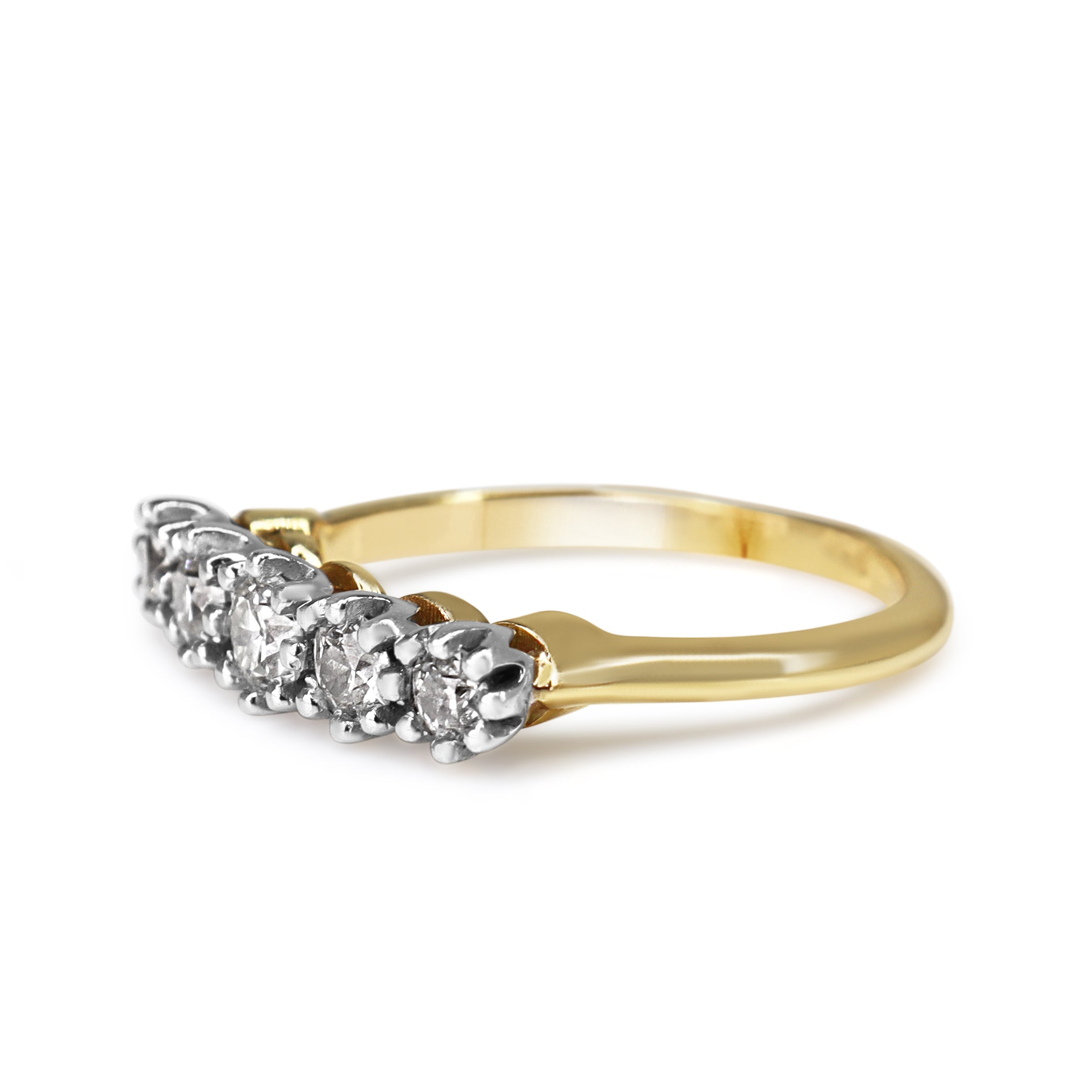 Angled view of a vintage five stone diamond ring with .70ct of G to H colour old cut diamonds