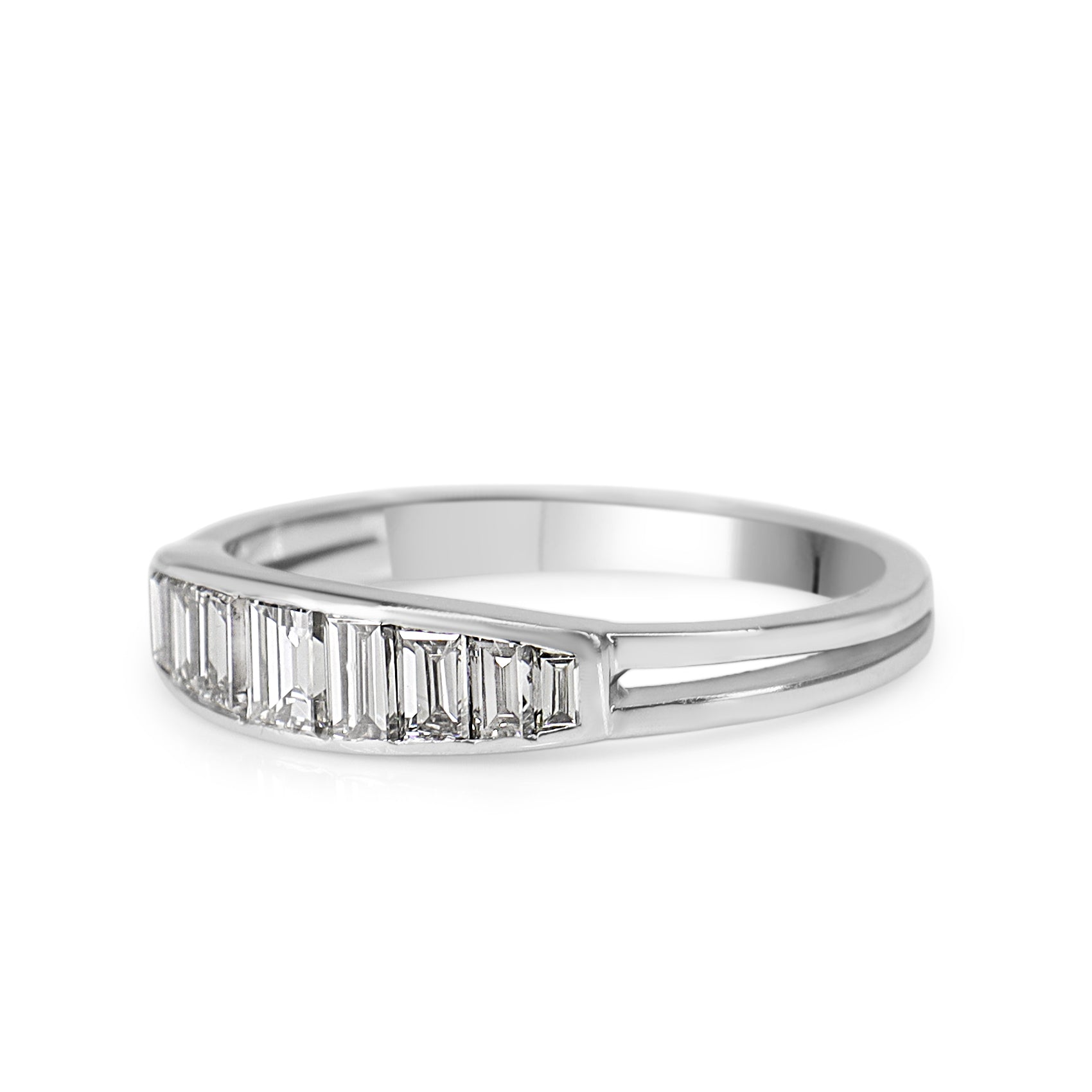 Angled view of a white gold graduated baguette diamond wedding ring with 1.00ct total diamond weight