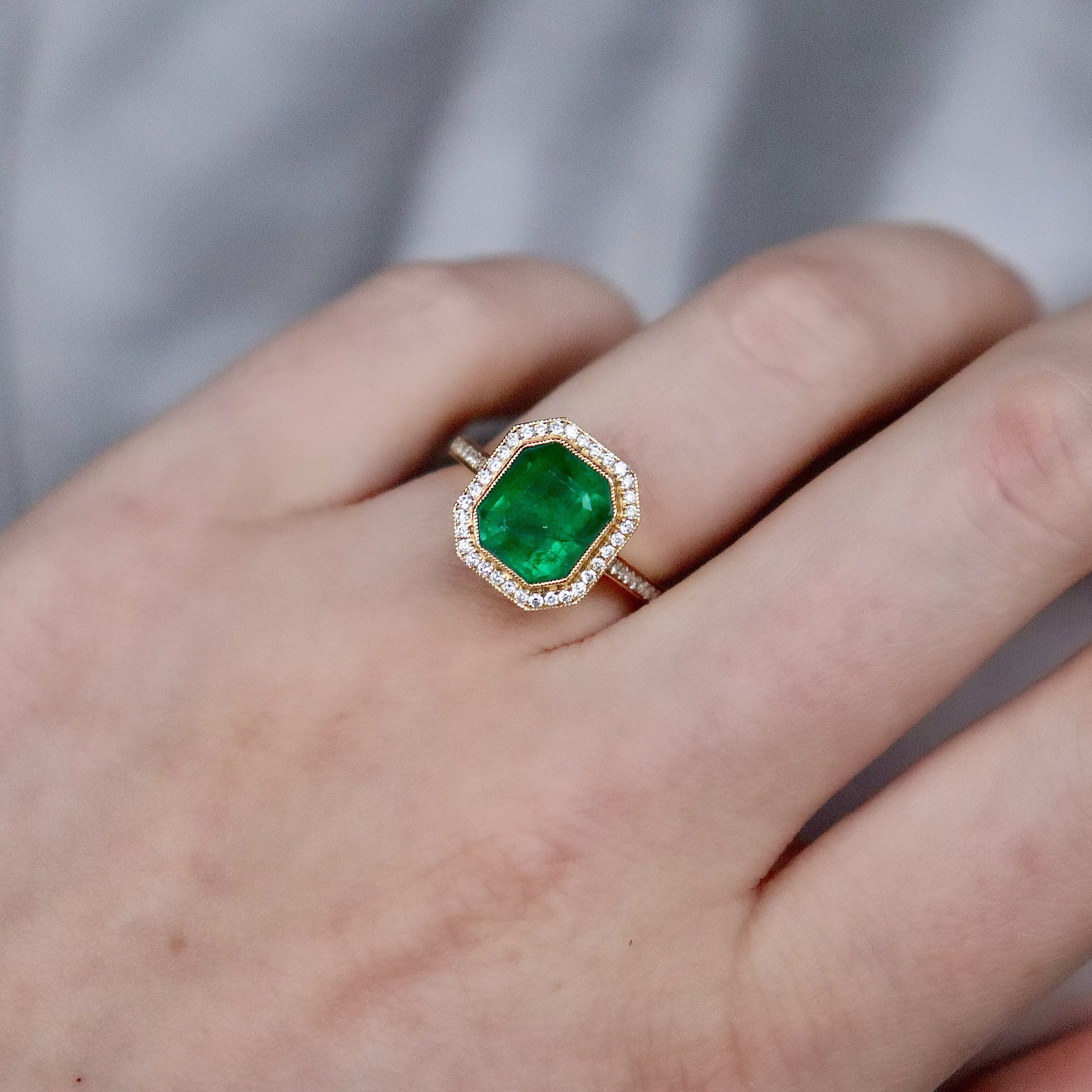 18ct Yellow Gold Emerald and Diamond Halo Ring