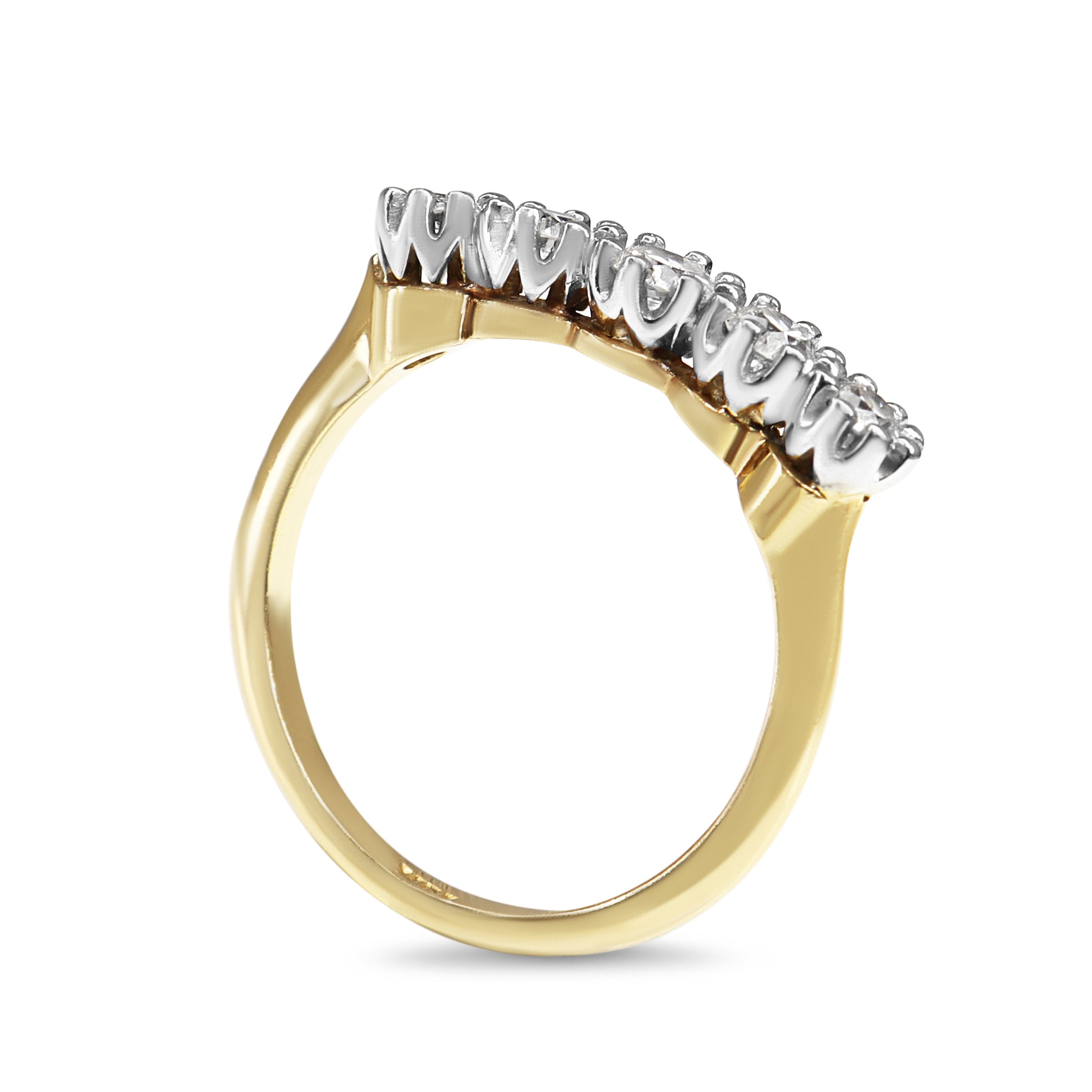 Detail view of G to H colour SI clarity old cut diamonds in a vintage five stone ring