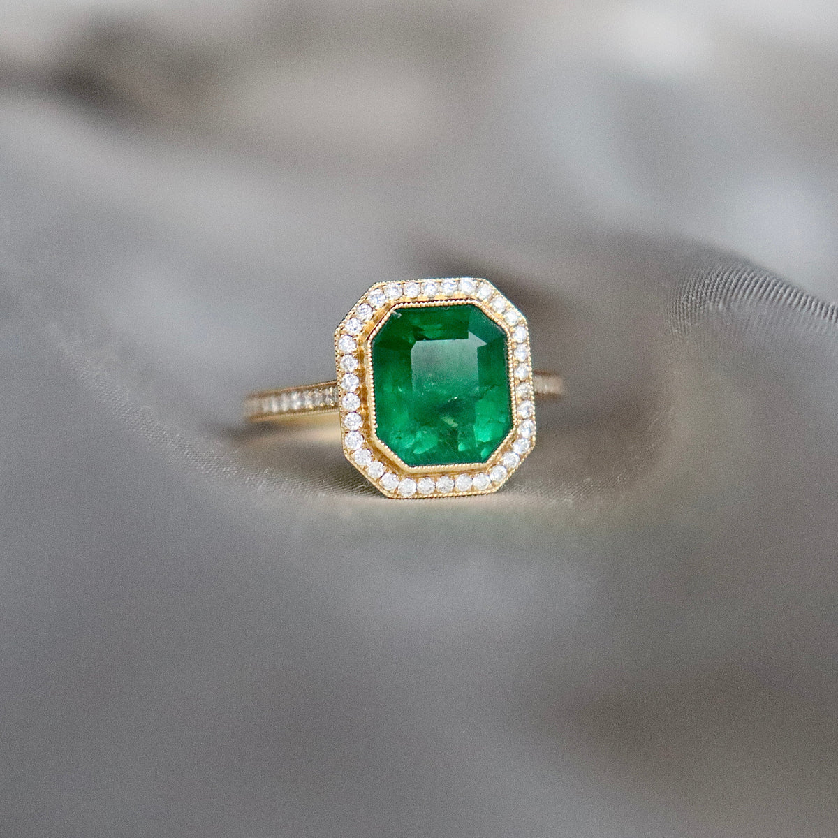18ct Yellow Gold Emerald and Diamond Halo Ring