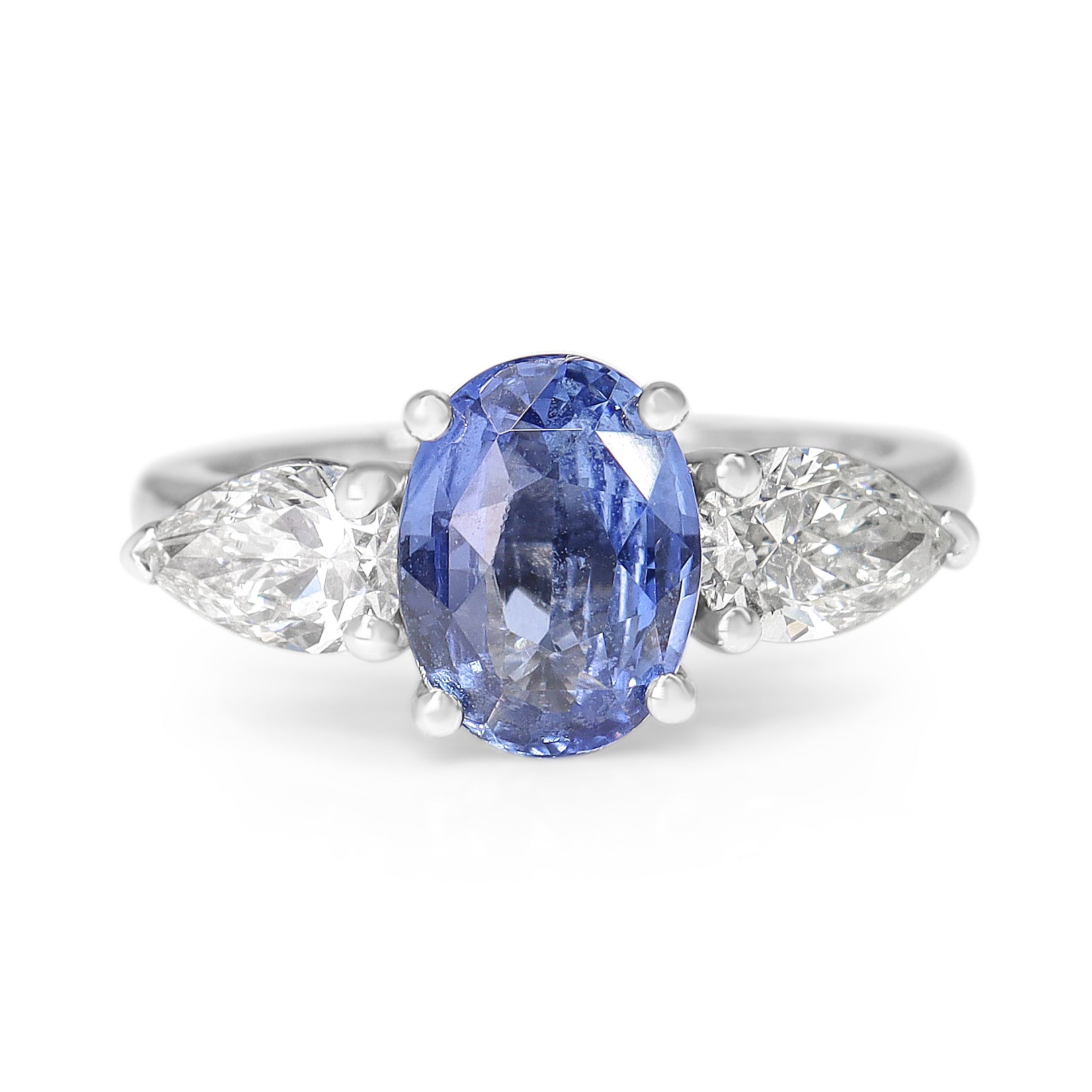 18ct White Gold Cornflower Blue Oval Sapphire and Pear Diamond 3 Stone Ring