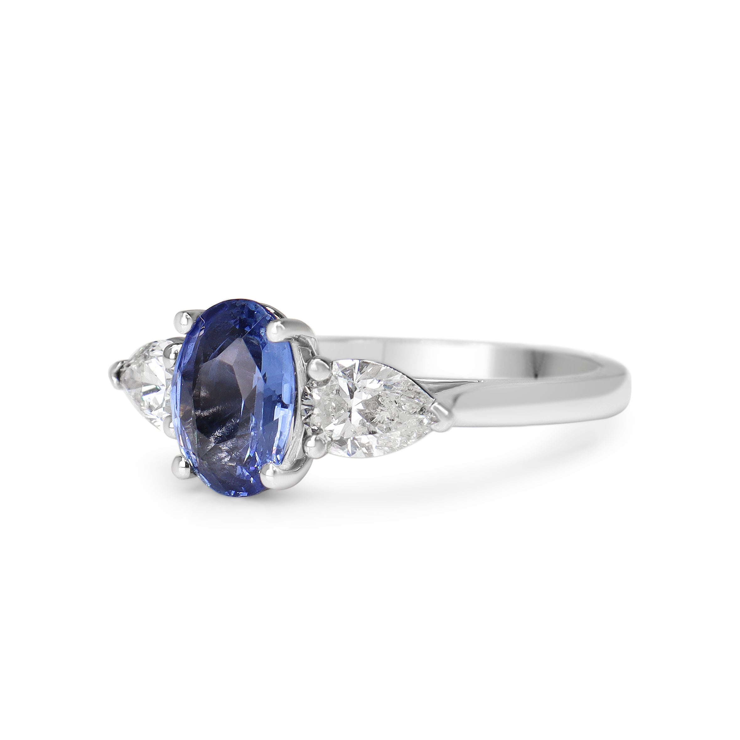 18ct White Gold Cornflower Blue Oval Sapphire and Pear Diamond 3 Stone Ring