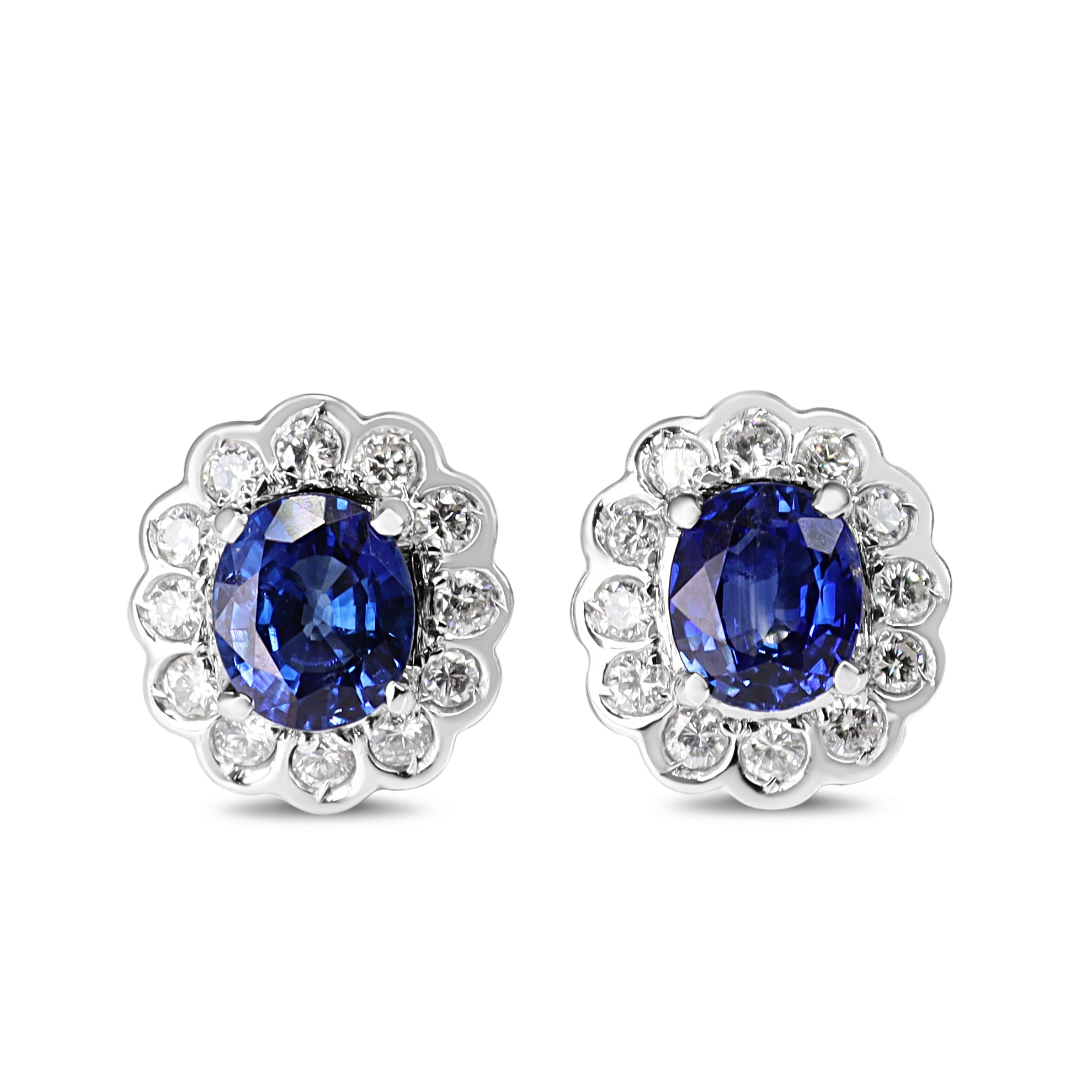 Platinum Oval Sapphire and Diamond Daisy Halo Earrings