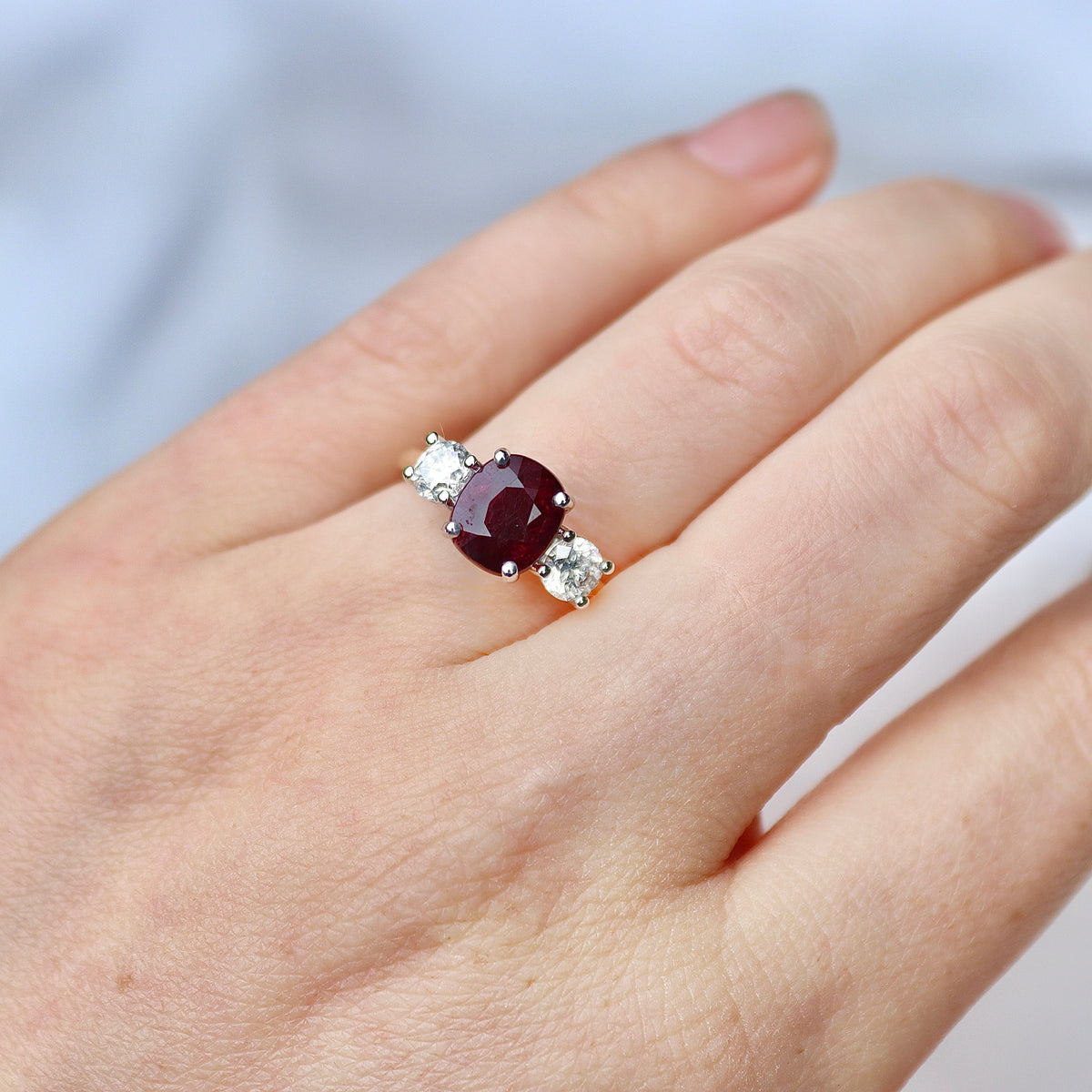 18ct Yellow and White Gold Oval Ruby and Round Diamond 3 Stone Ring
