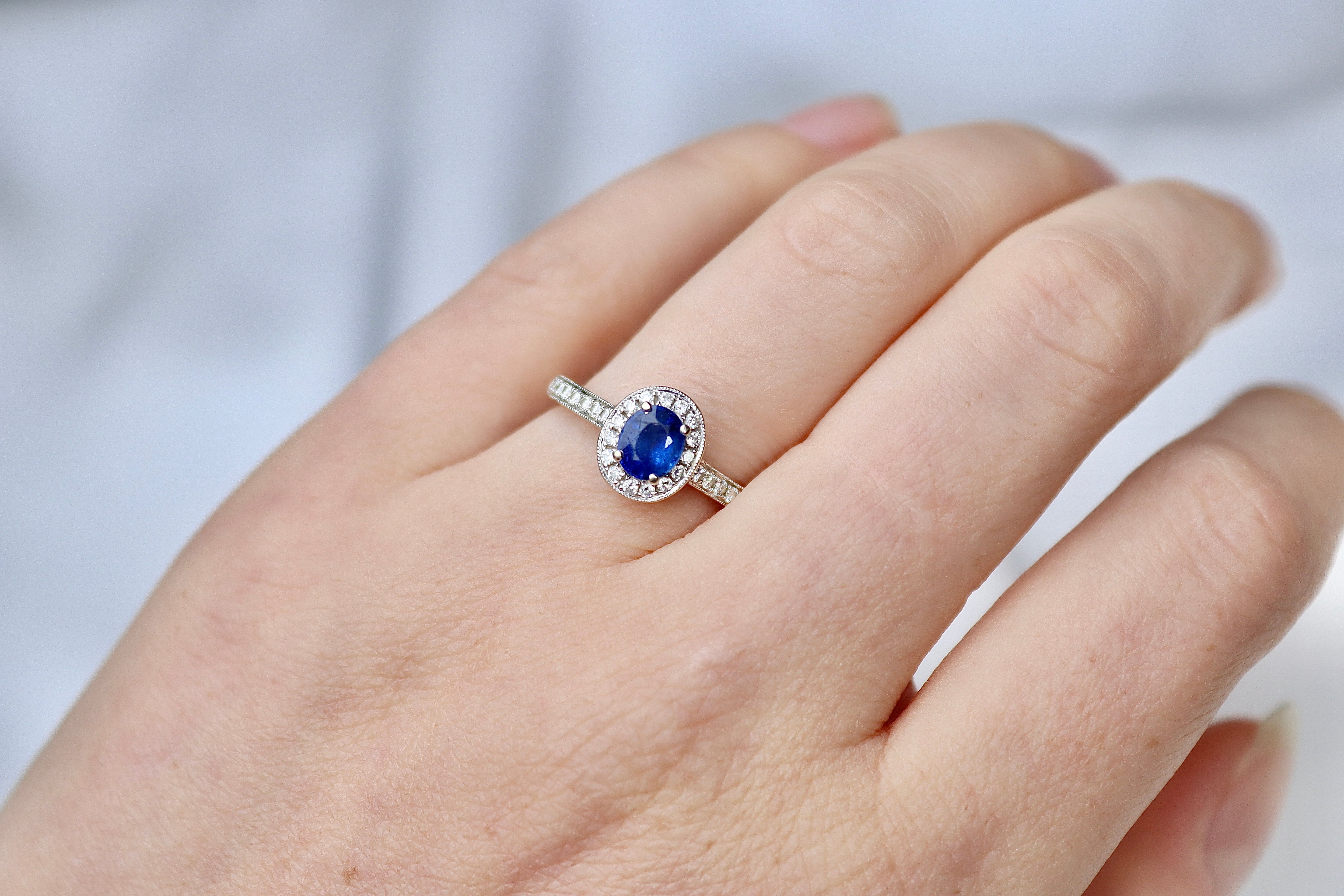 18ct White Gold Oval Sapphire and Diamond Halo Ring