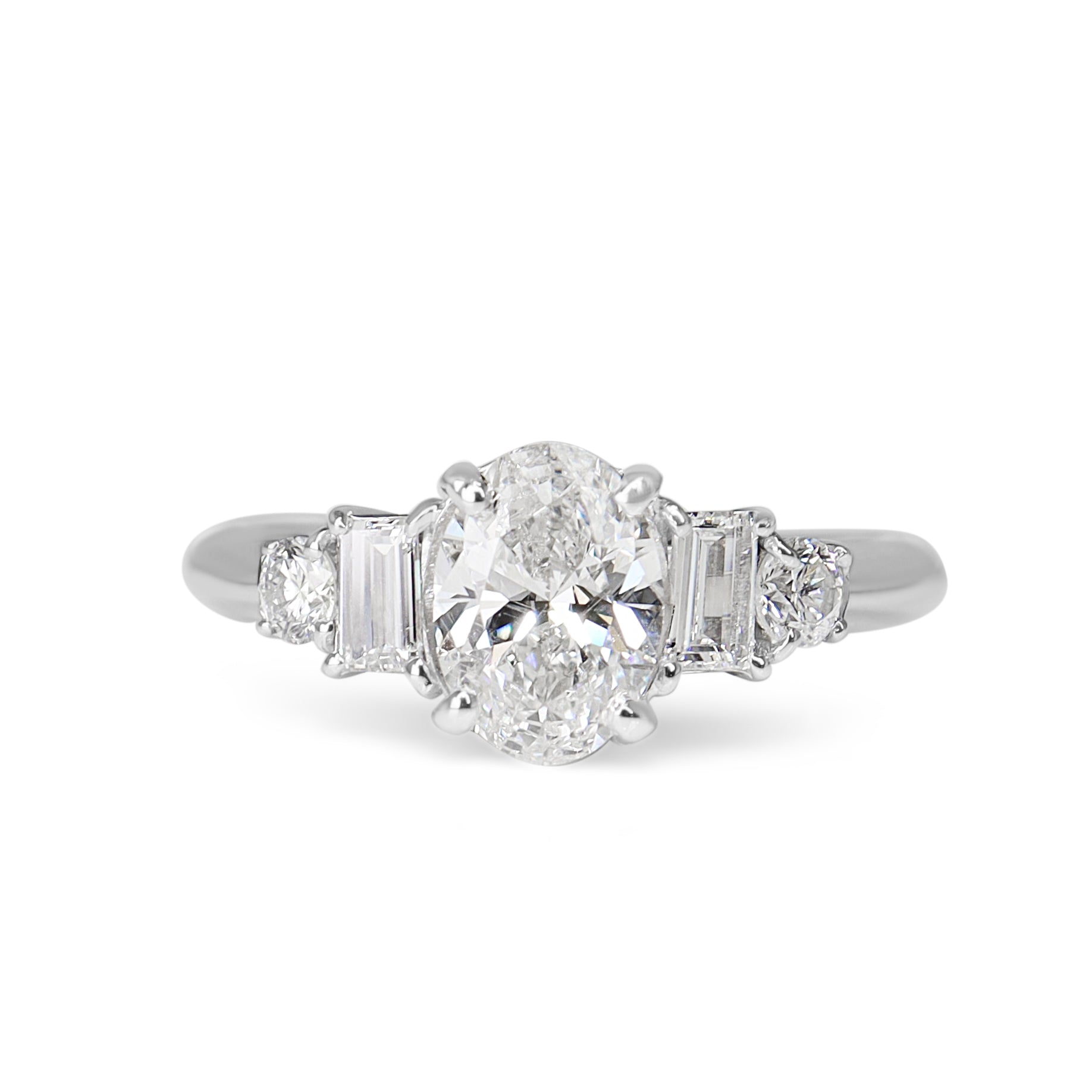 Platinum Oval and Baguette Diamond 5 Stone Ring