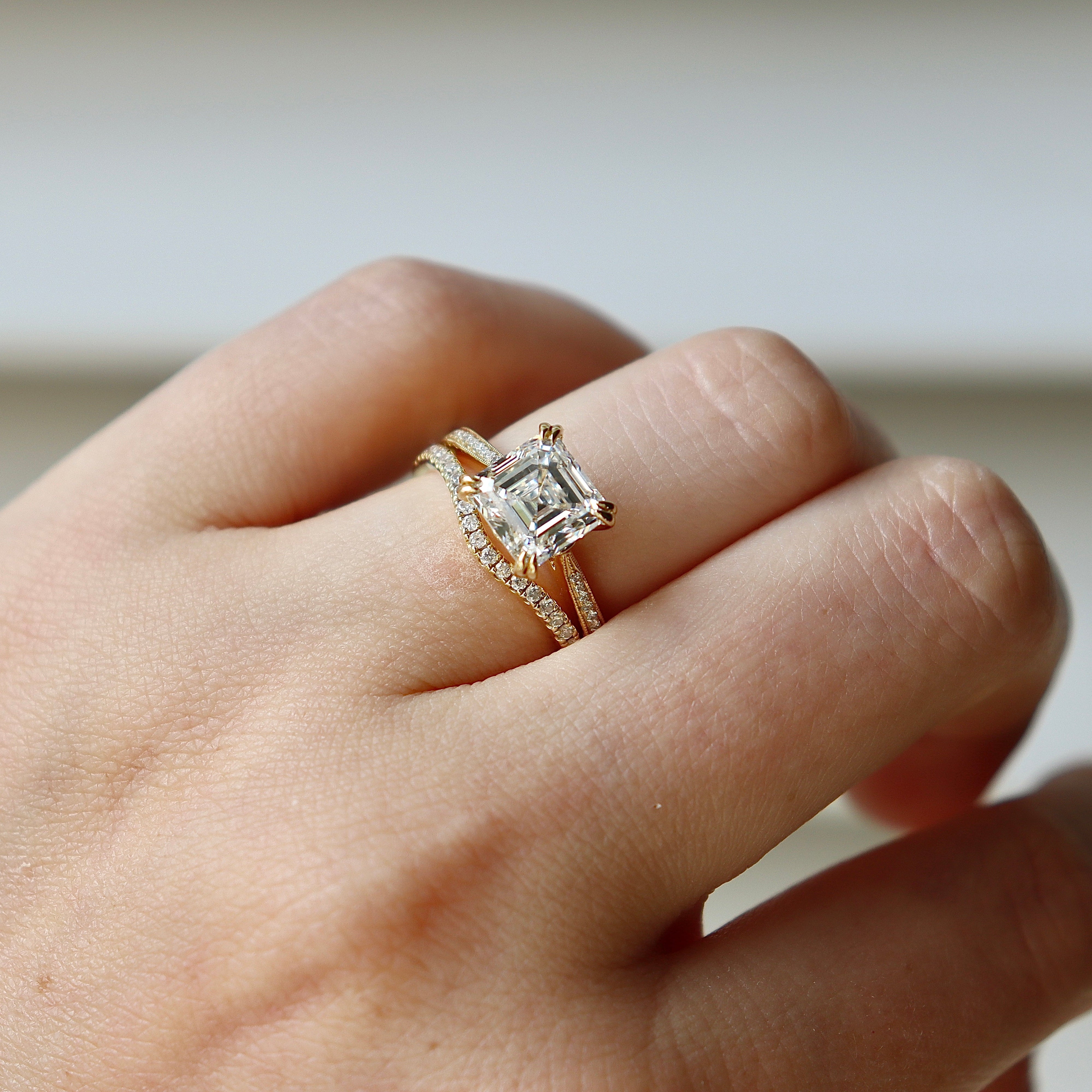 Close detail of an 18ct yellow gold curved band featuring .25ct total diamond weight
