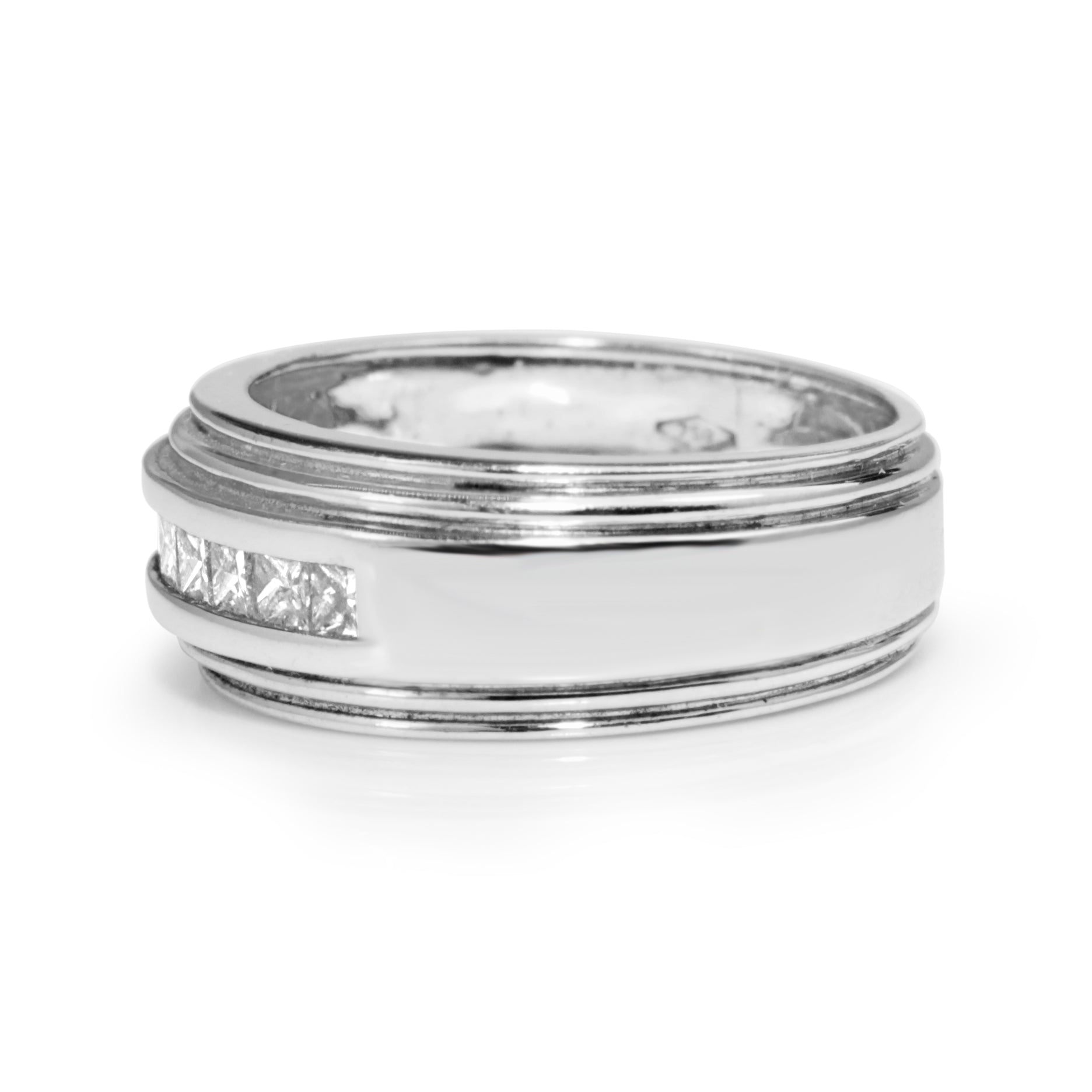 Angled view of wide vintage 18ct white gold princess cut diamond band showing the diamond-set front and plain side
