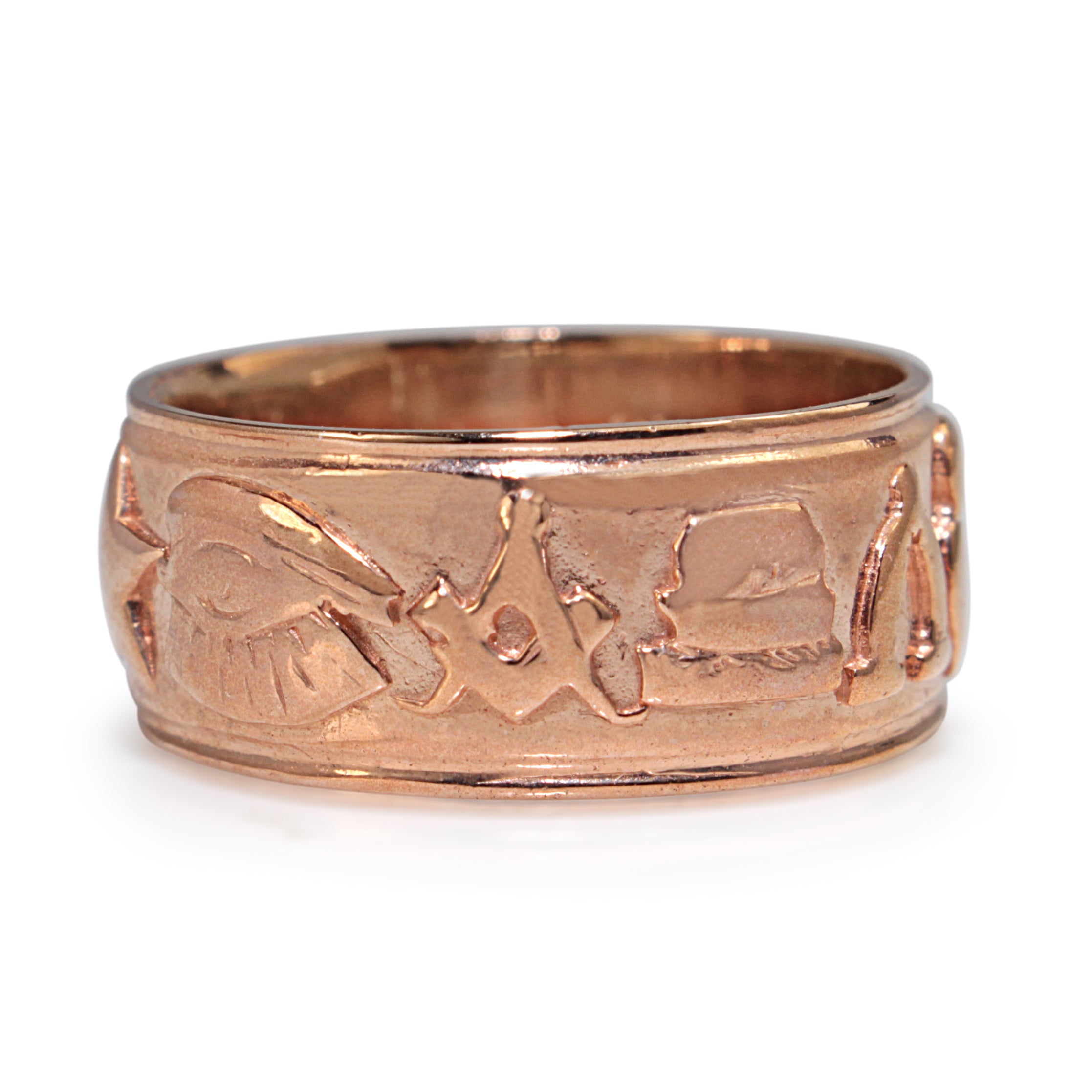 Front detail of 9ct rose gold Masonic ring showing raised symbols across the band
