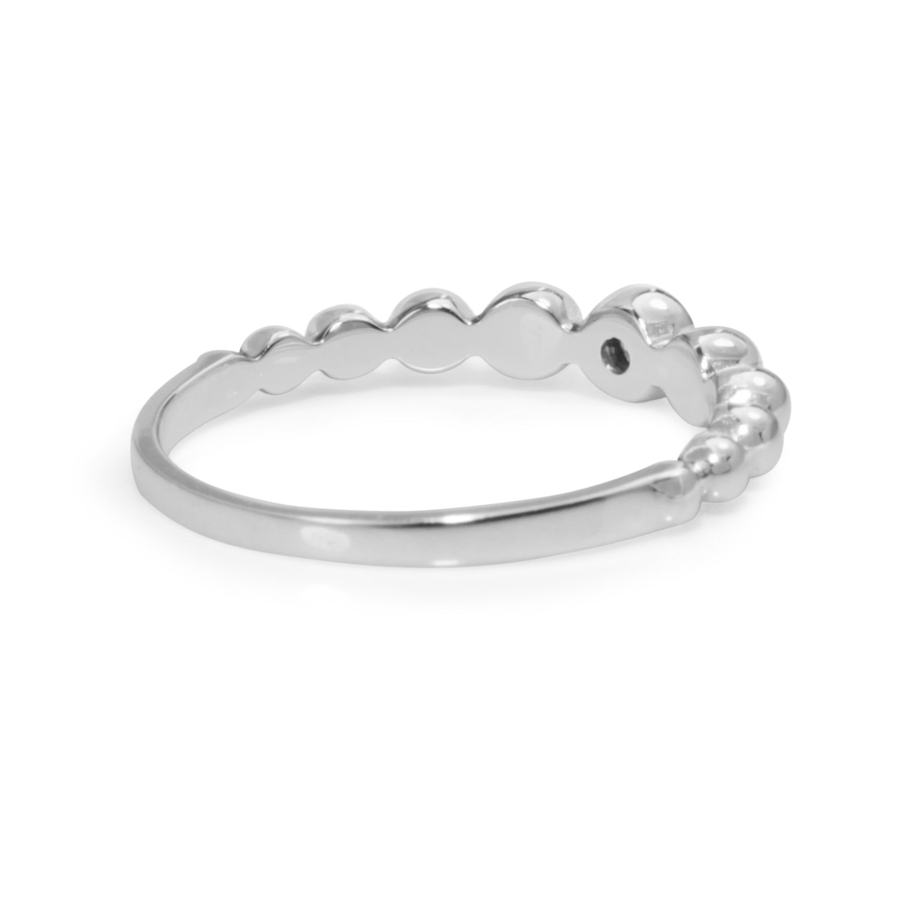 Side profile of 9ct white gold diamond bubble ring showing the raised rounded front design