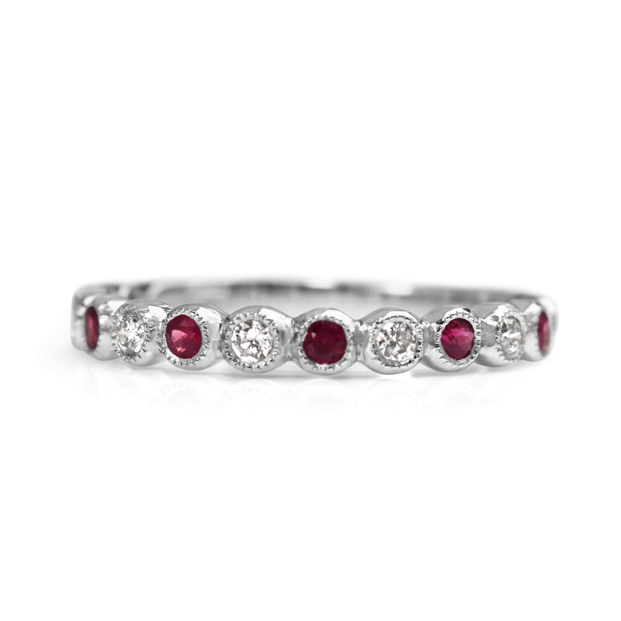 Front view of a 9ct white gold ruby and diamond bezel set band