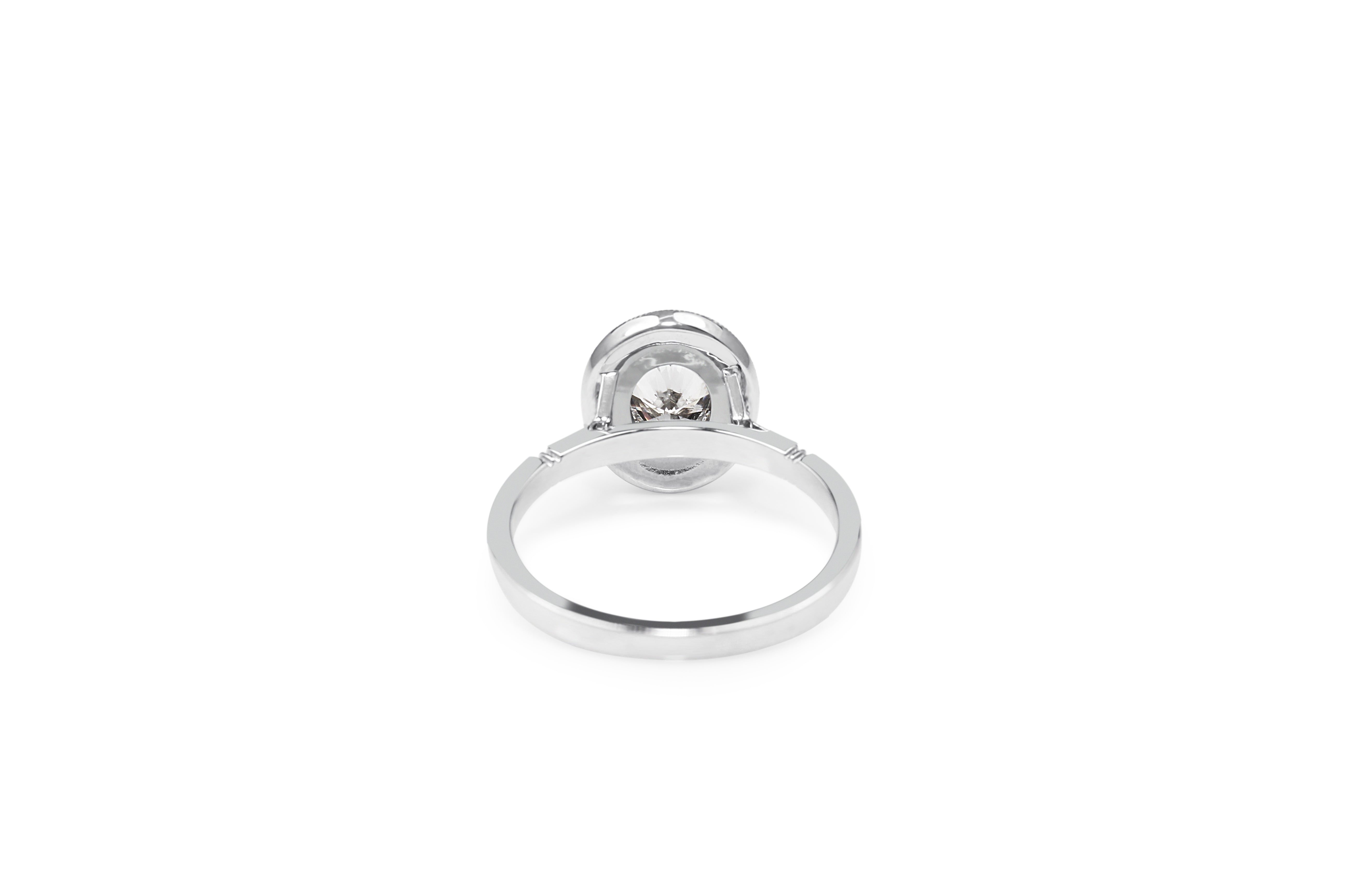 Oval Bezel Halo Diamond Ring