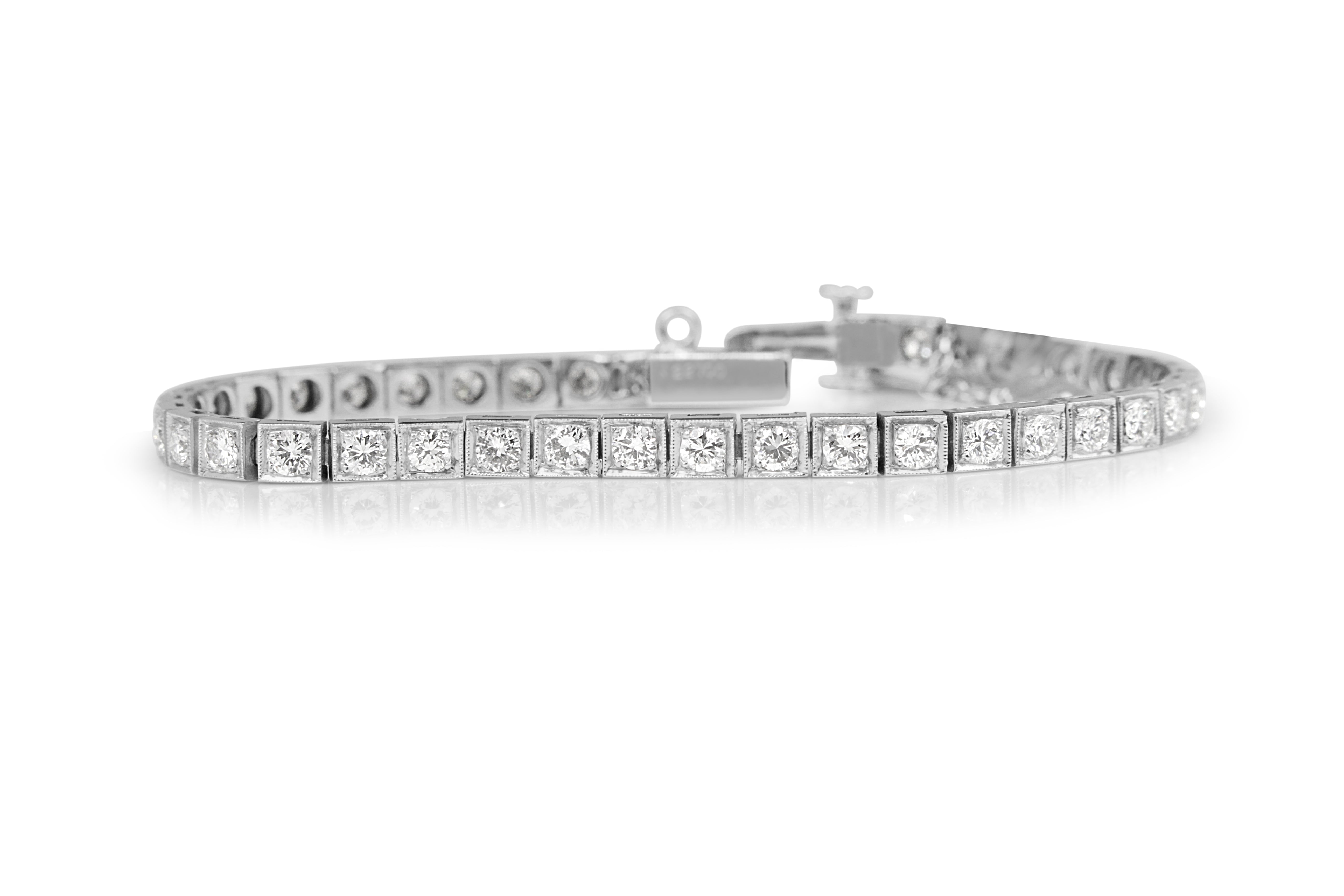 Platinum diamond tennis bracelet on hand close‑up