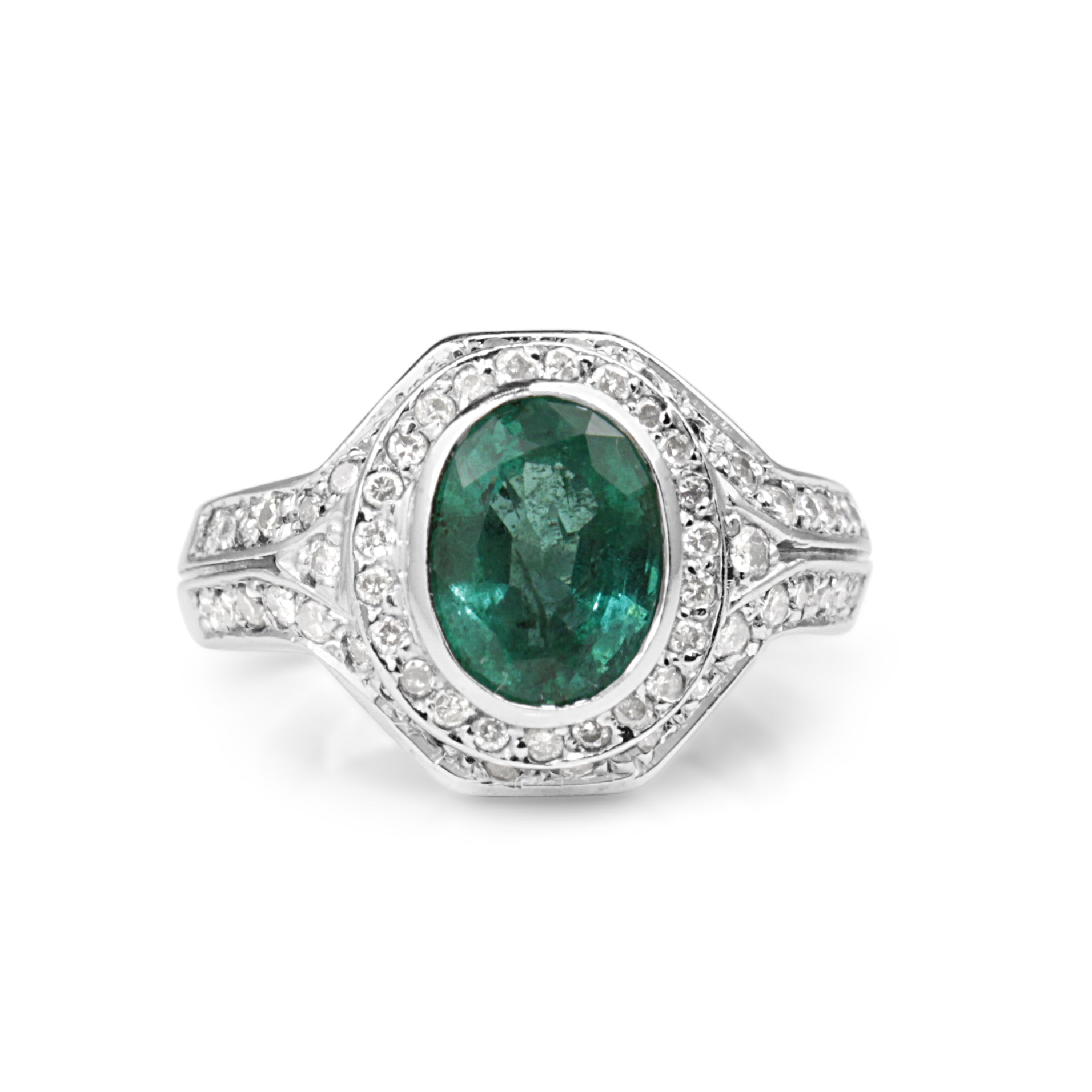 18ct white gold emerald and diamond halo ring close‑up