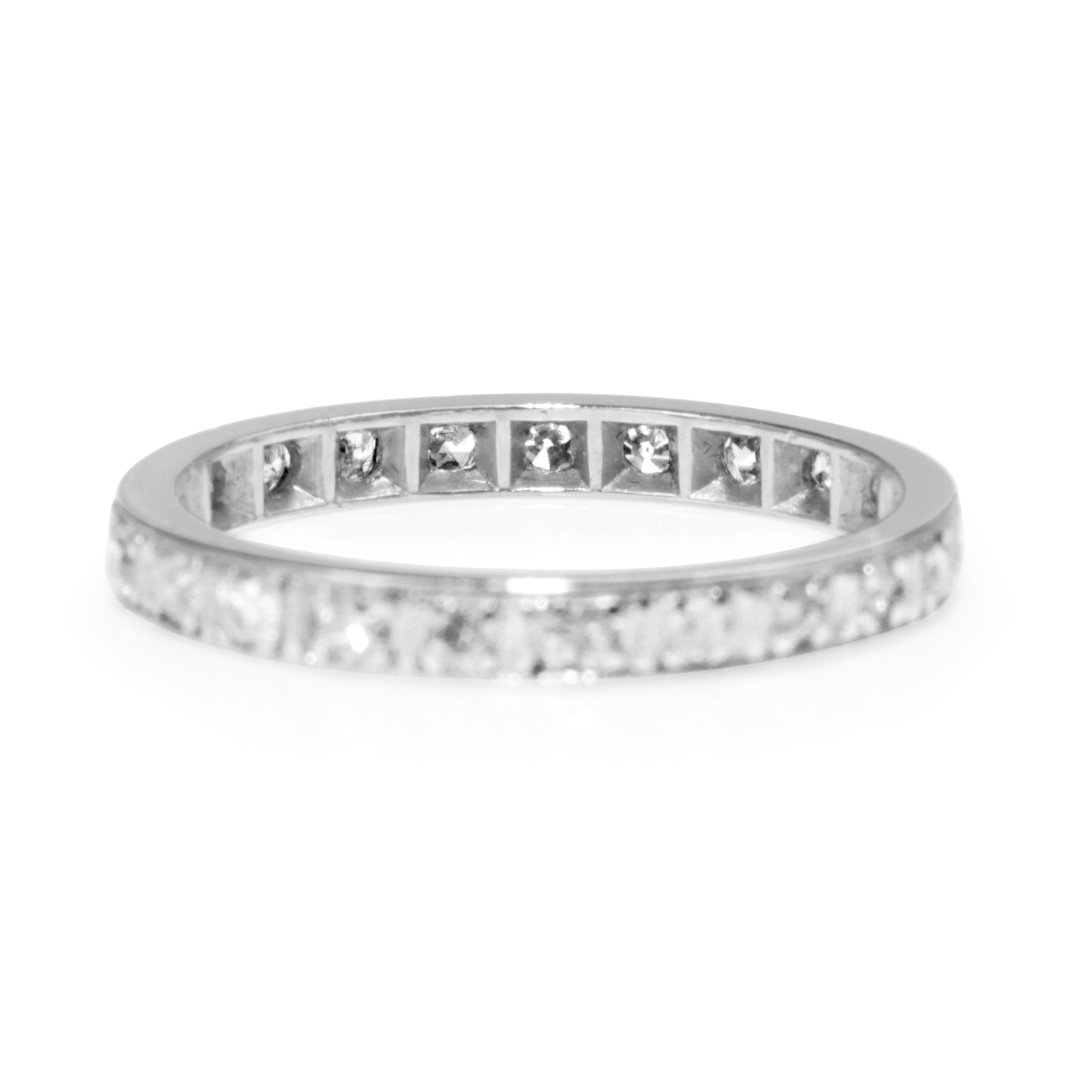 Wedding band platinum ring close up diamonds