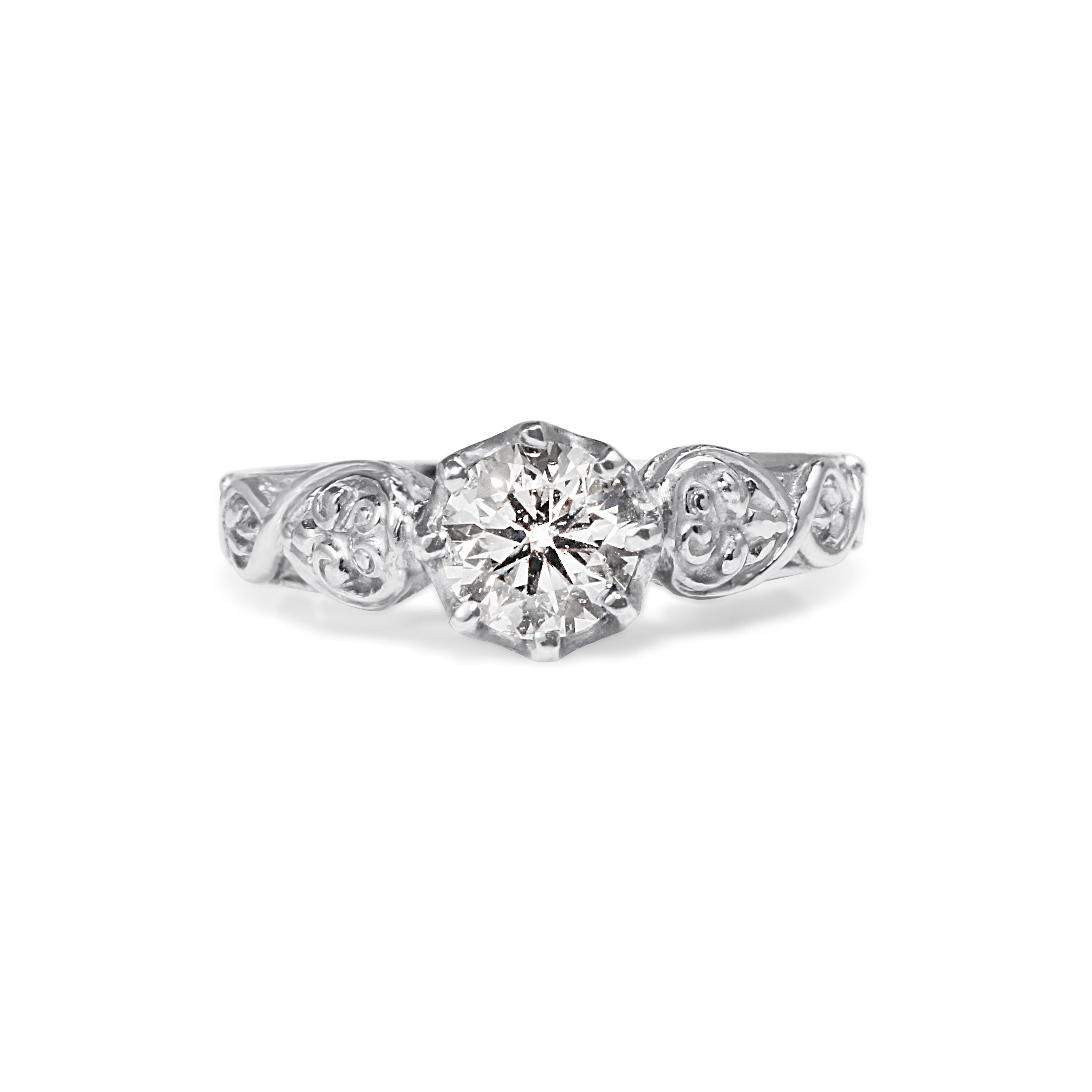 Premium diamond solitaire ring close-up platinum engraving