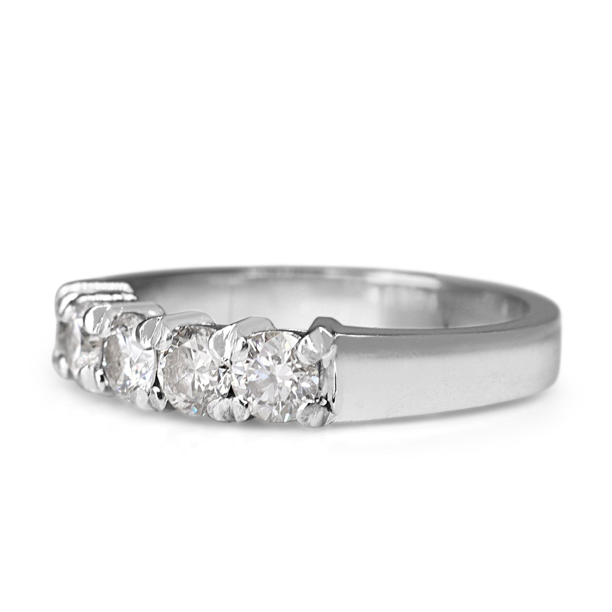 18ct white gold five stone diamond ring displayed upright with a balanced row of sparkling diamonds