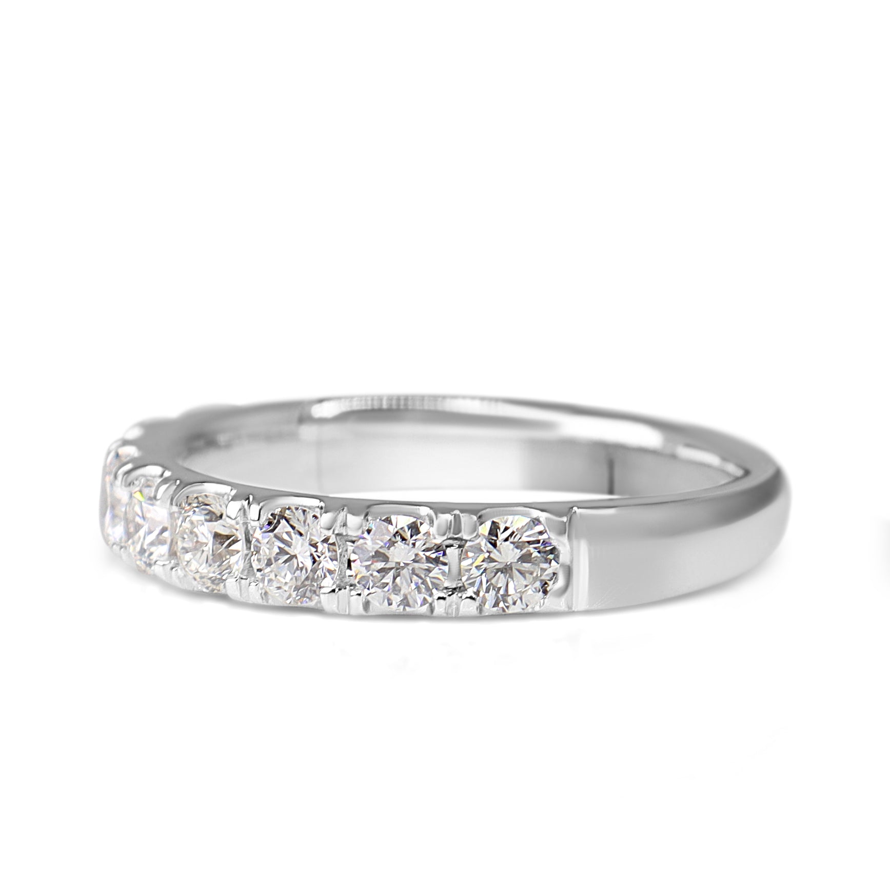 Angled side view of 18ct white gold diamond half hoop band showing the diamond-set front and polished band