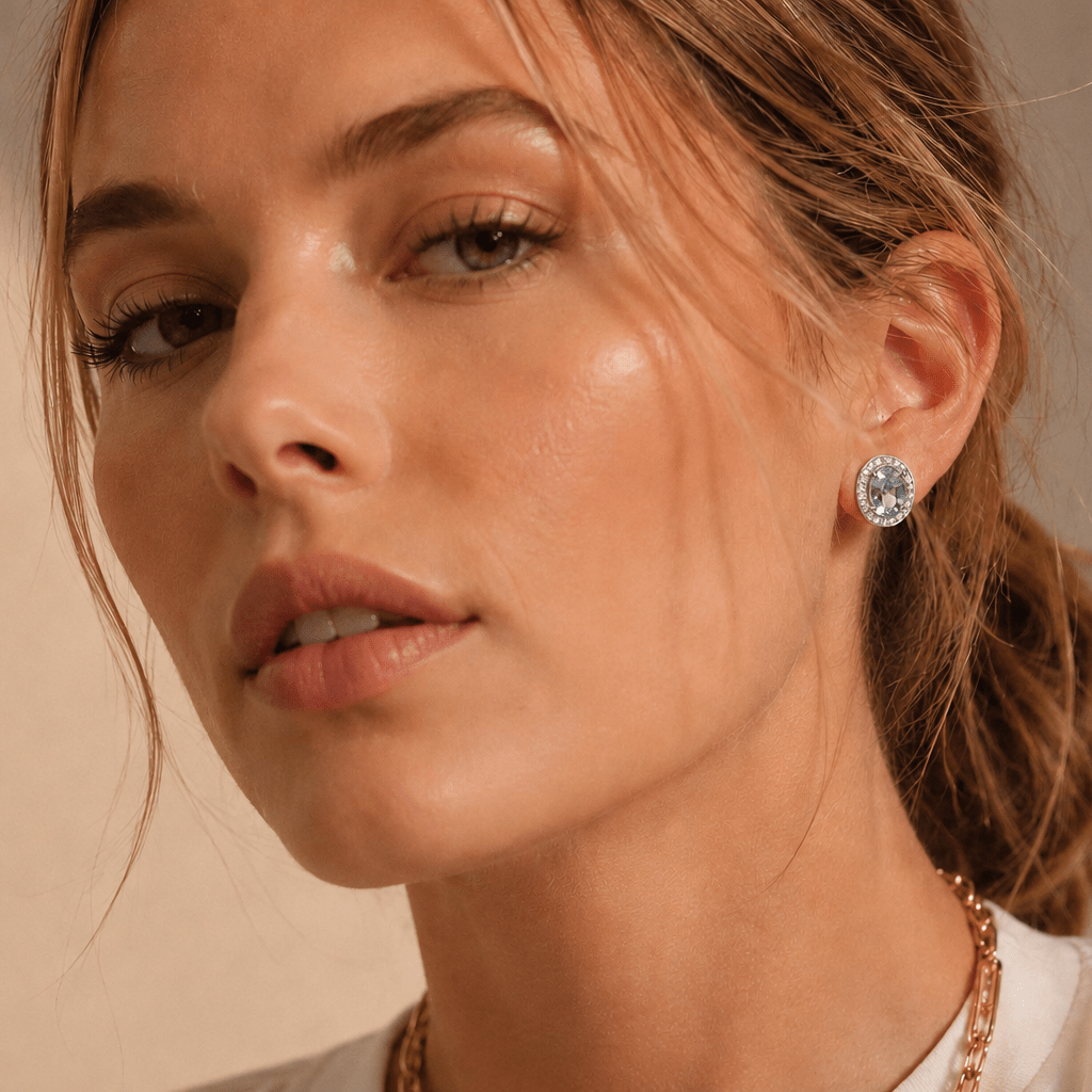 18ct White Gold Oval Aquamarine and Diamond Halo Stud Earrings - Burlington Jewellery