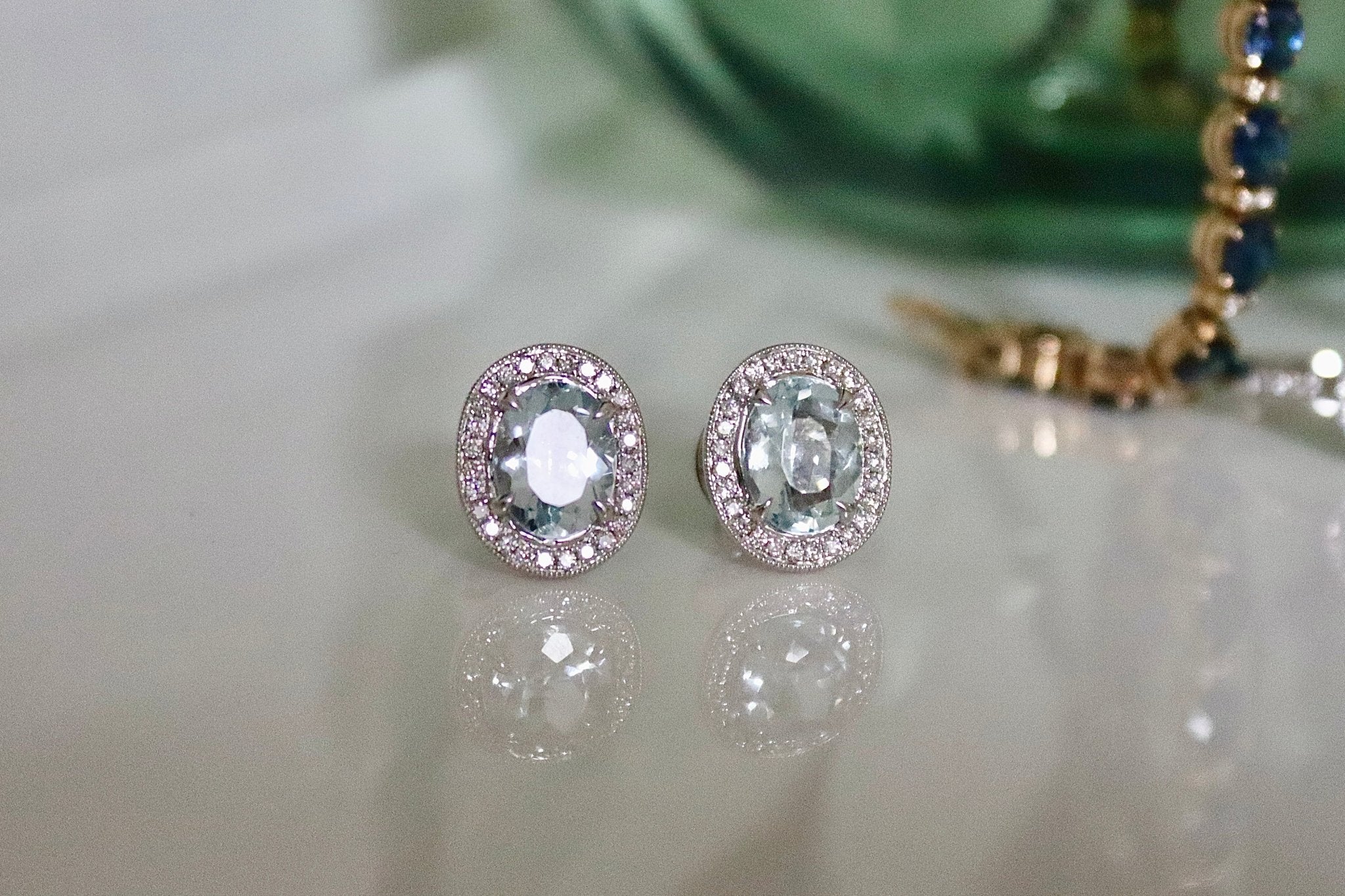 18ct White Gold Oval Aquamarine and Diamond Halo Stud Earrings - Burlington Jewellery