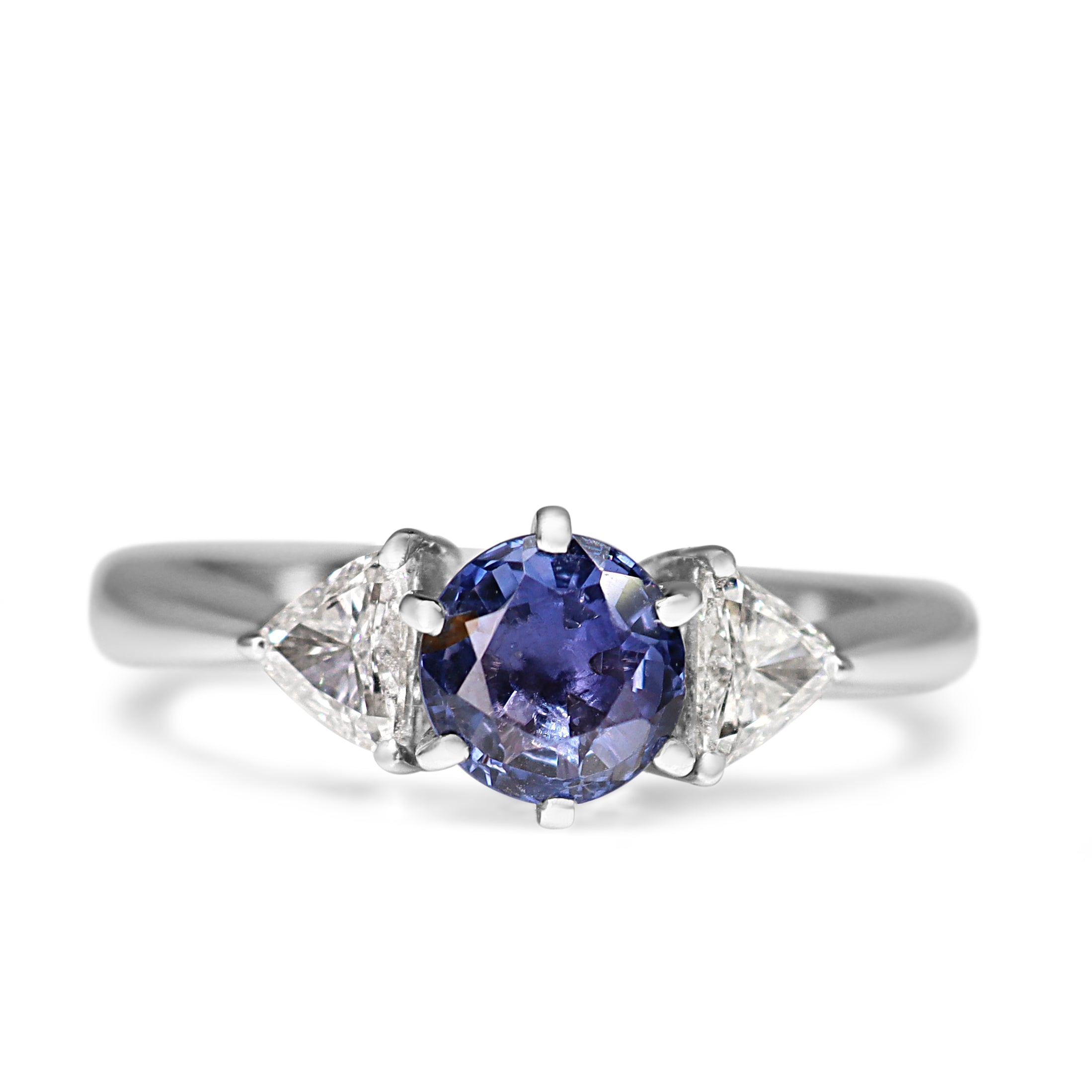18ct white gold three stone ring with round sapphire and trillion diamonds shown from the front