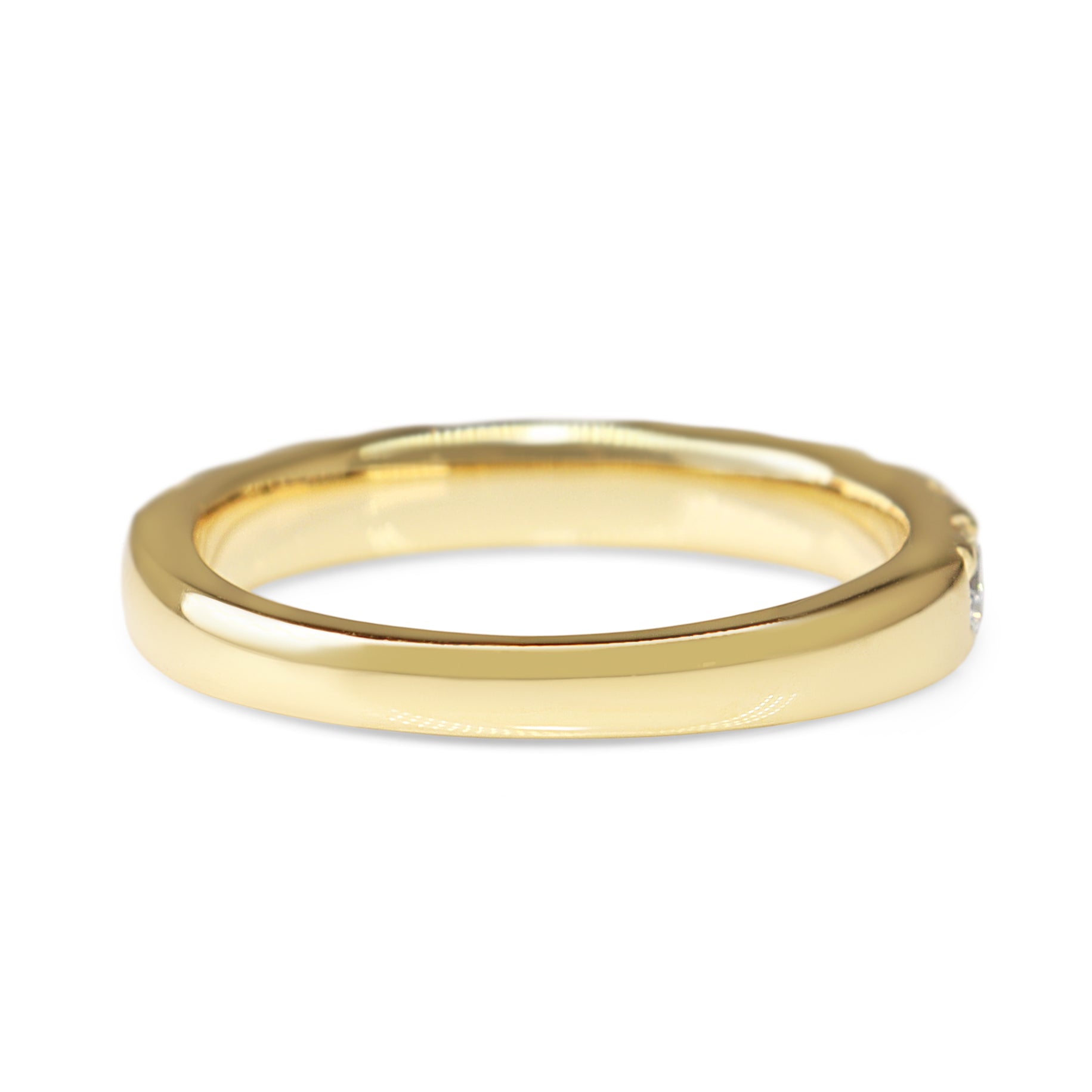 Side view of the 18ct yellow gold diamond half hoop ring