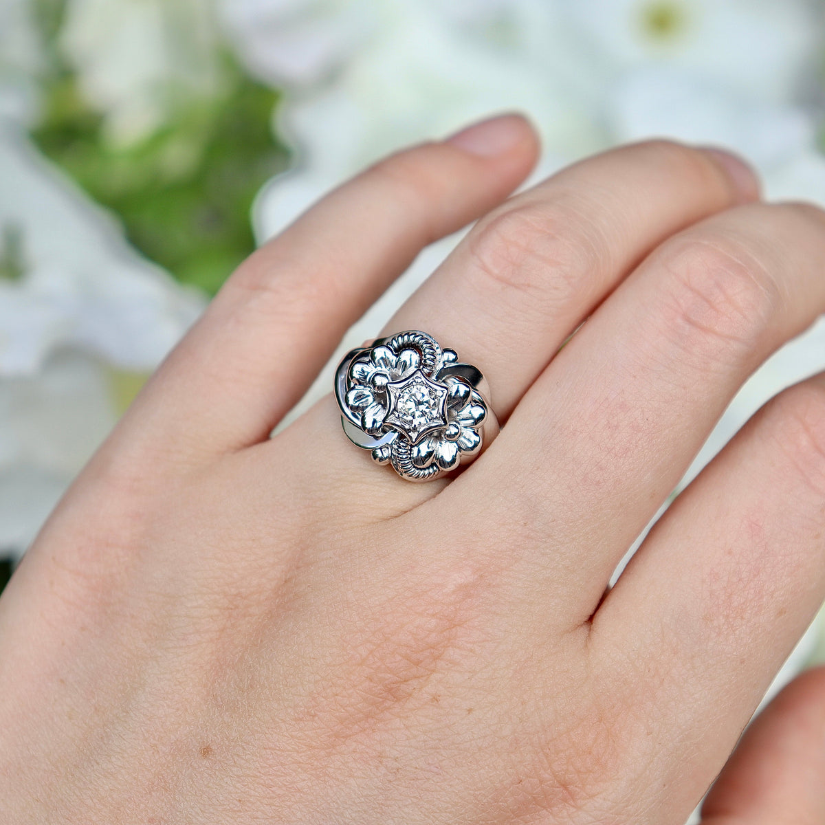 Ornate diamond ring on hand for engagement or wedding
