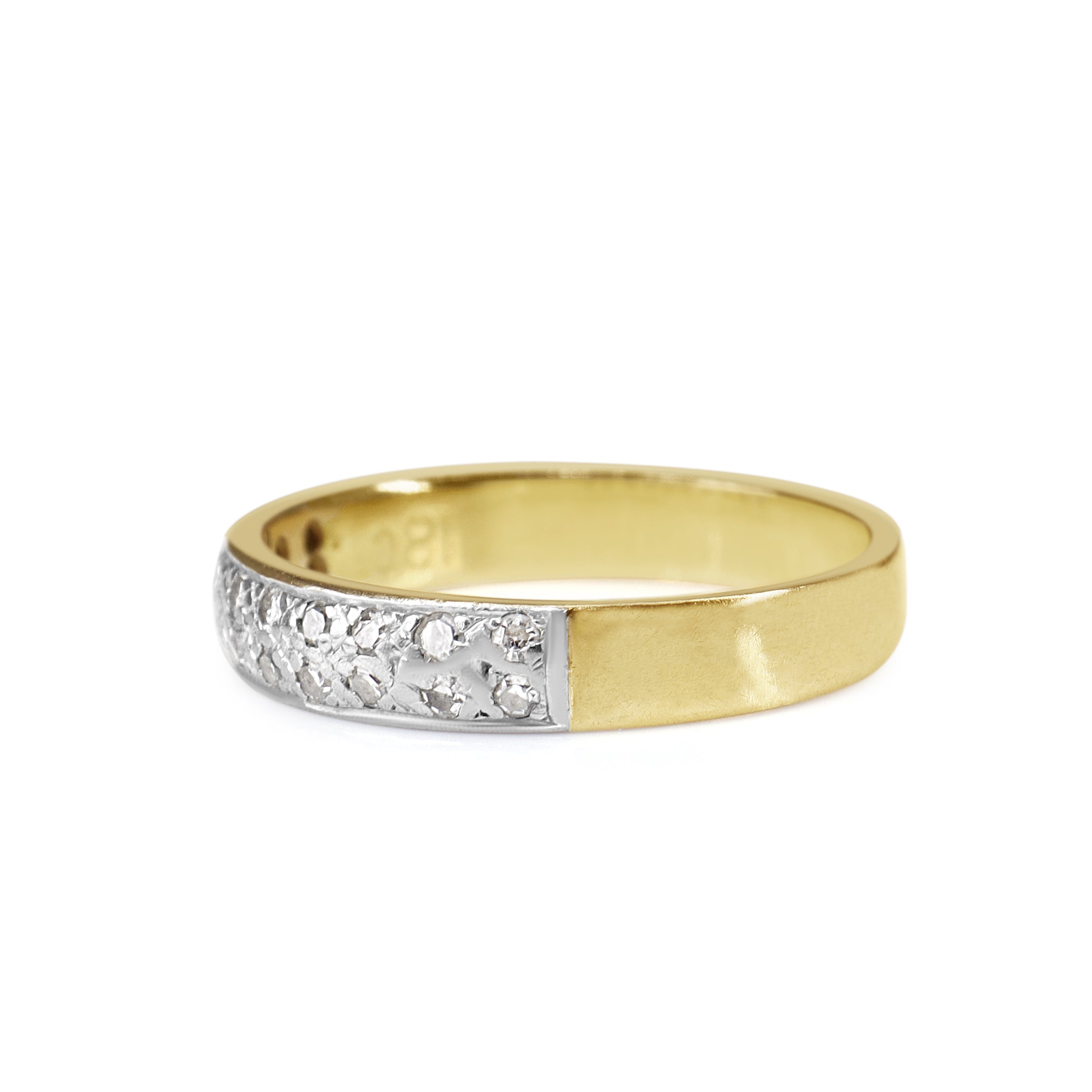 Side profile of an 18ct two-tone diamond wedding ring in size L 1/2