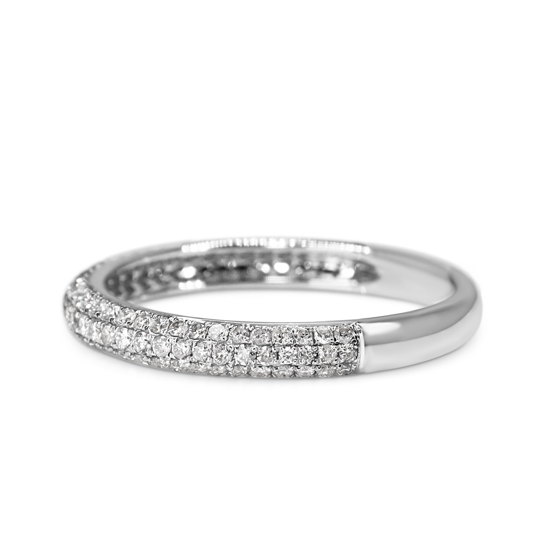 Side profile of a slim 2.5mm white gold pavé diamond wedding ring in size M