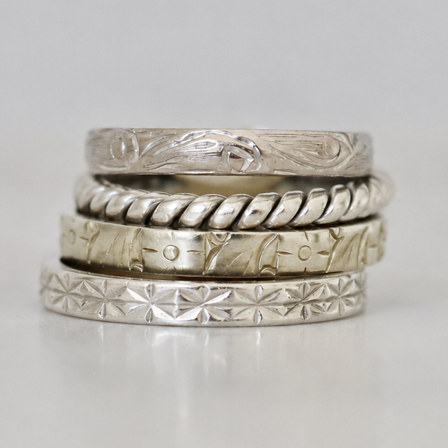 Platinum twist band ring photographed flat to show its continuous intertwined design and elegant narrow profile