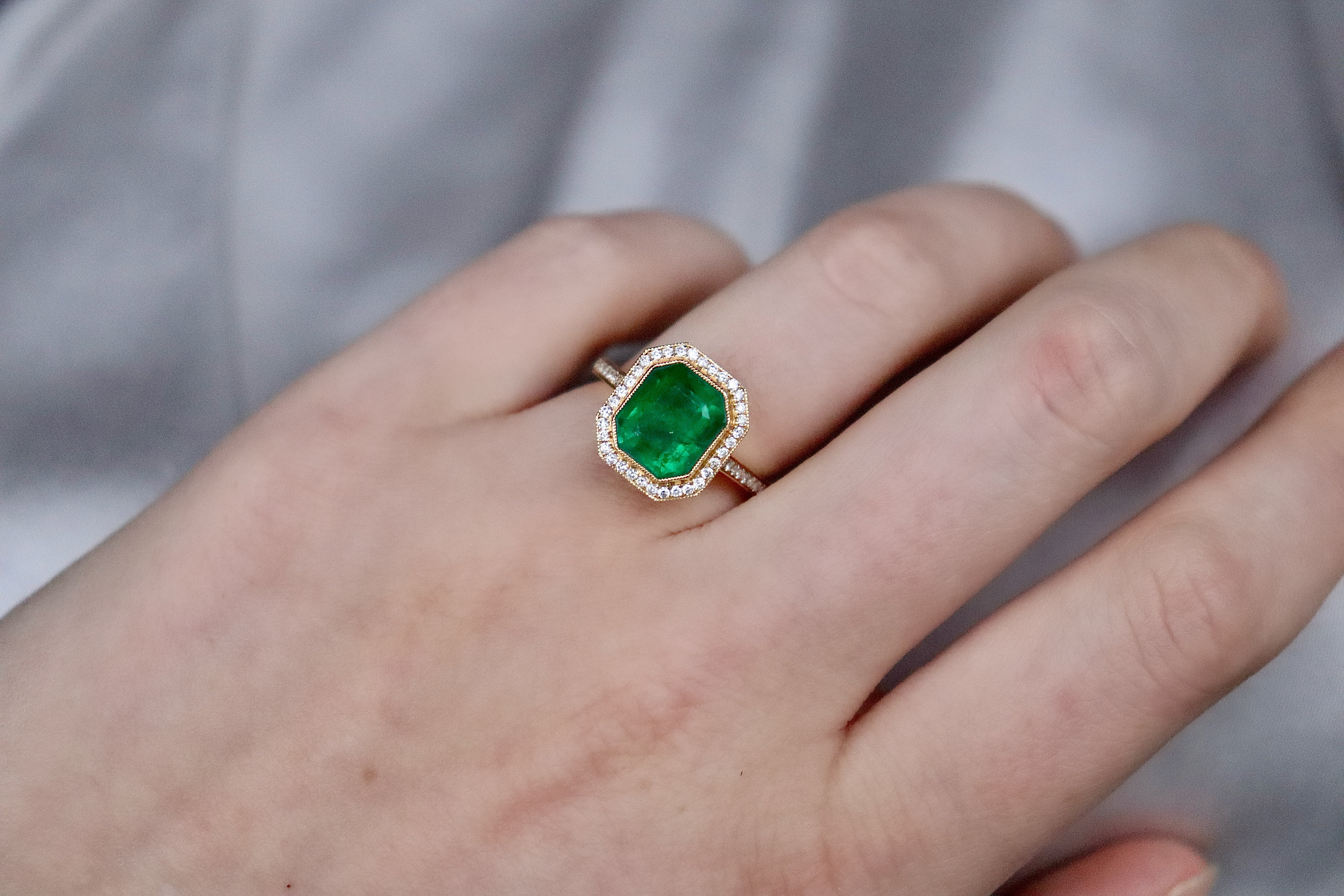 18ct Yellow Gold Emerald and Diamond Halo Ring