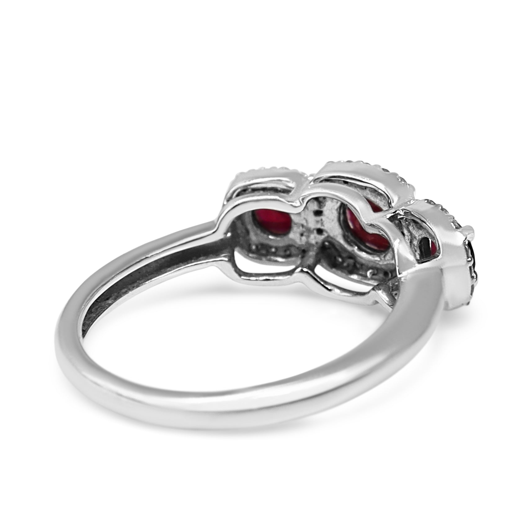 14ct White Gold Ruby 3 Stone and Diamond Halo Ring