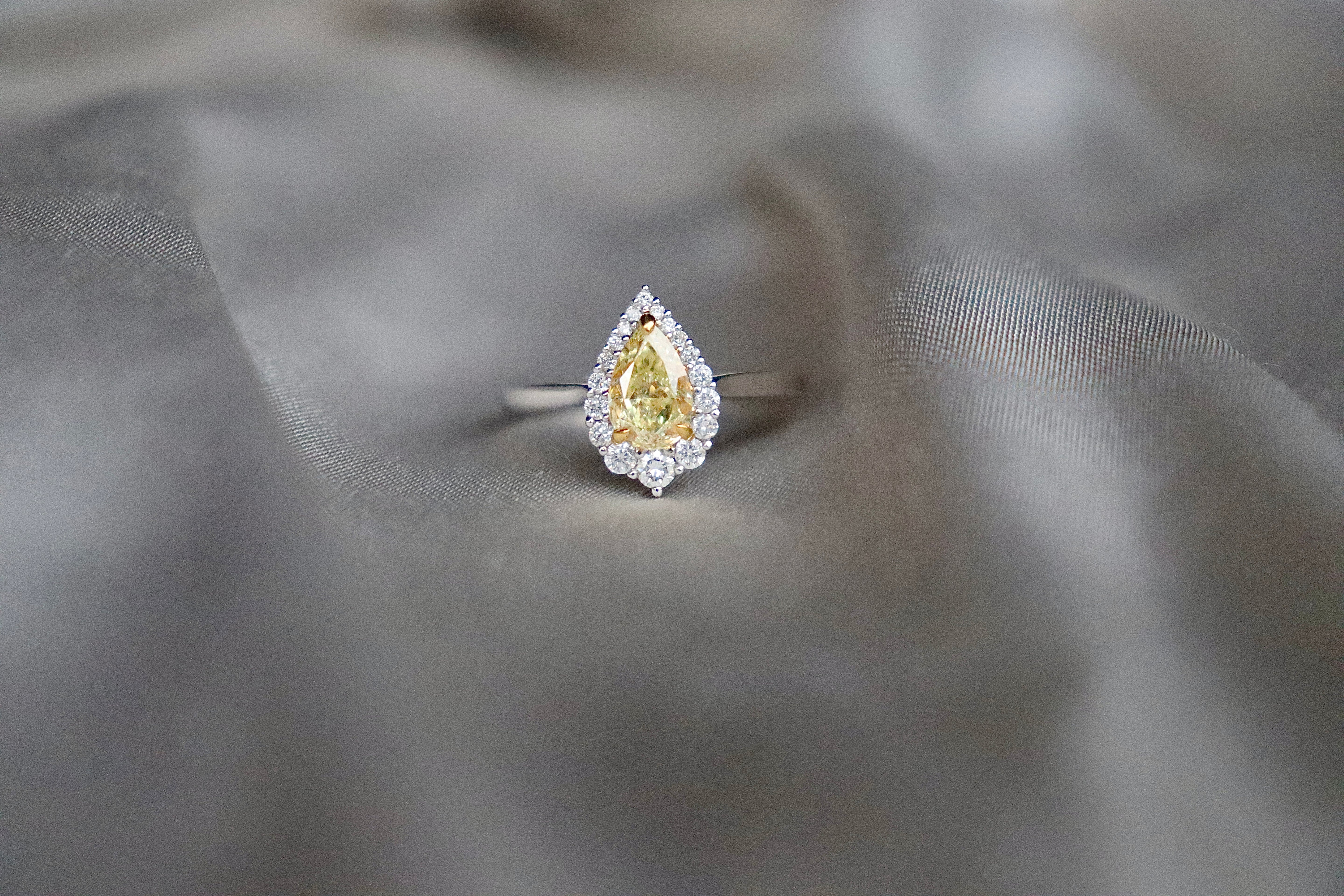 18ct White Gold Yellow Pear Diamond and Graduated Halo Ring