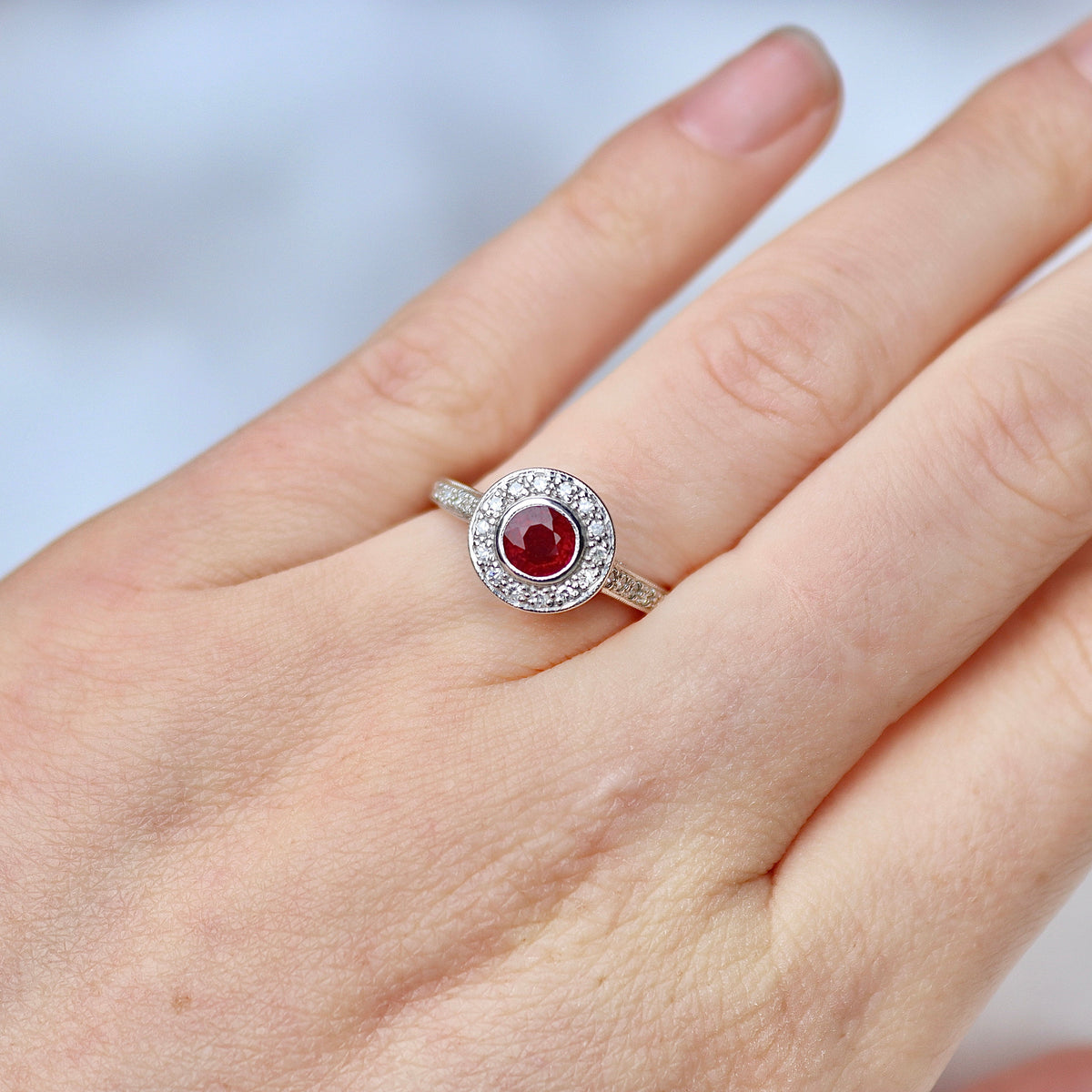 18ct White Gold Ruby and Single Cut Diamond Halo Ring