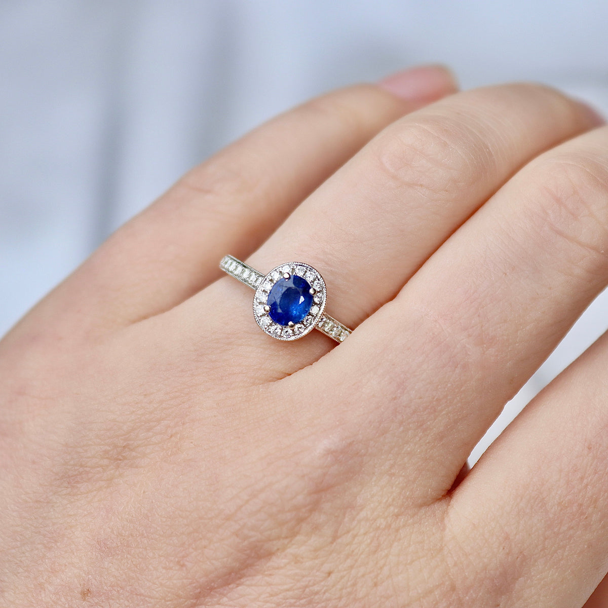 18ct White Gold Oval Sapphire and Diamond Halo Ring