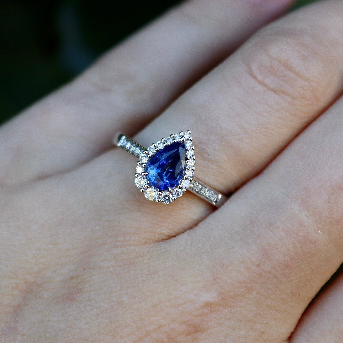 18ct White Gold Pear Shaped Sapphire and Diamond Graduated Halo Ring