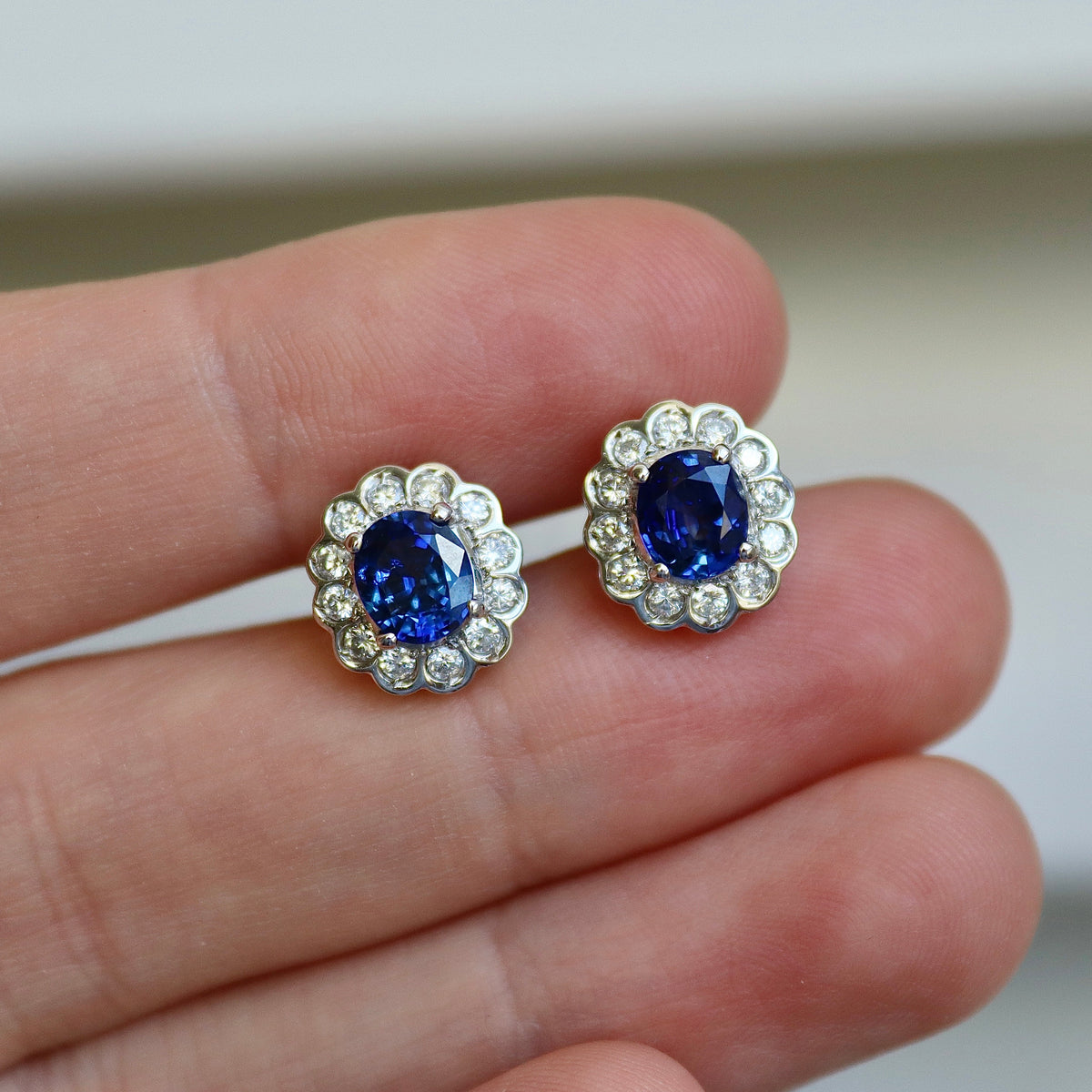 Platinum Oval Sapphire and Diamond Daisy Halo Earrings