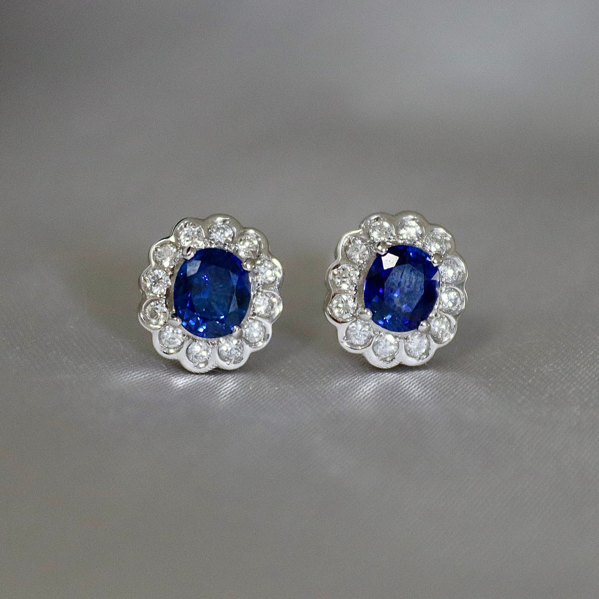 Platinum Oval Sapphire and Diamond Daisy Halo Earrings