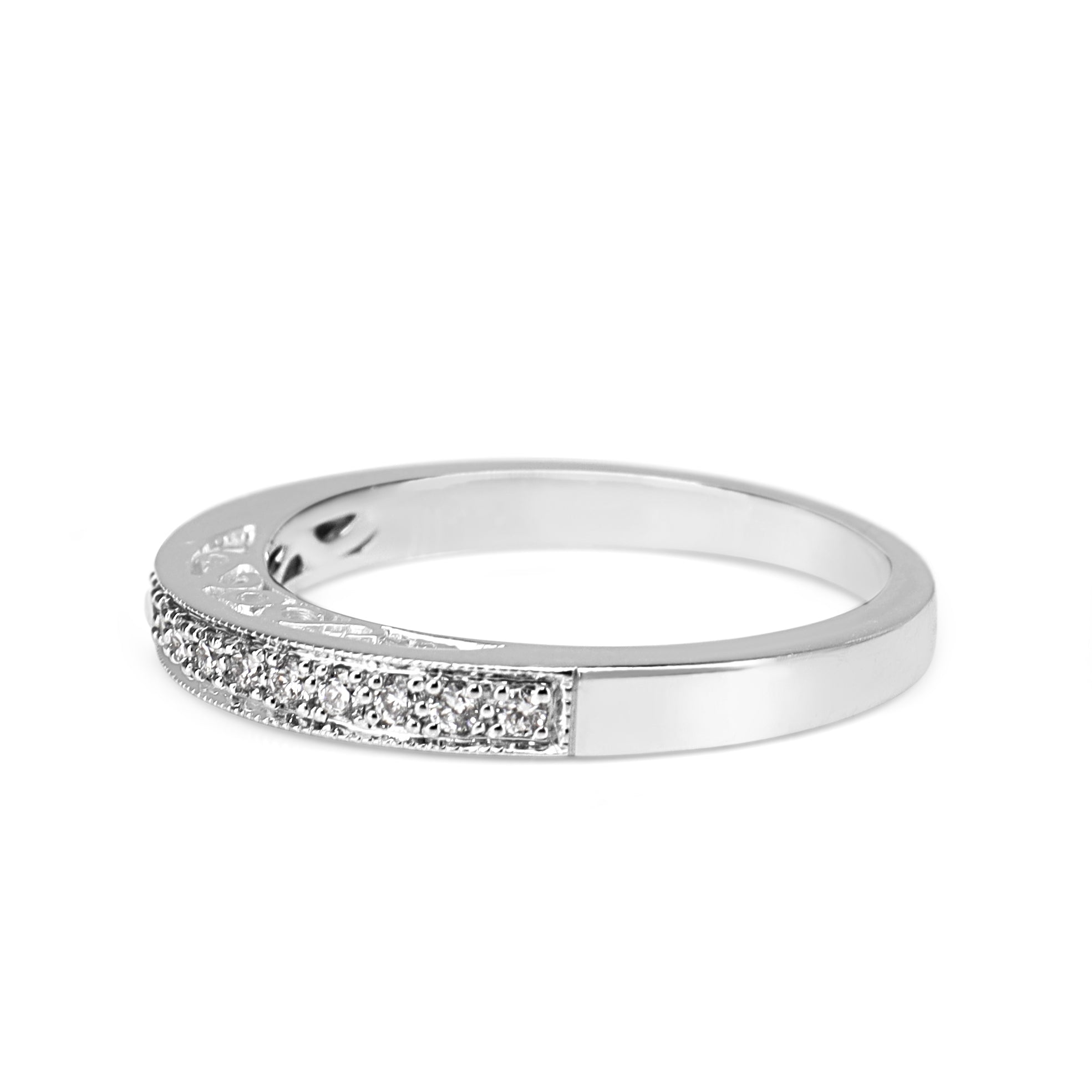 Detail view of G colour VS to SI clarity diamonds in a white gold wedding ring